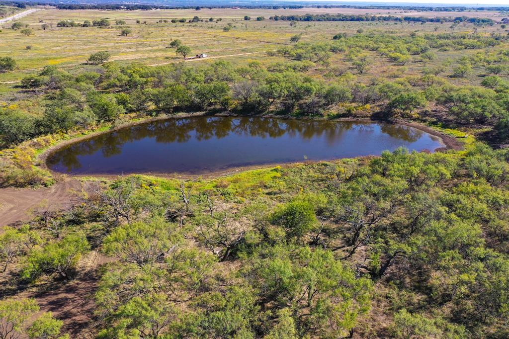 Owner Financing Available, 15% down payment. Perfect tract of land to build your dream home, ranch or weekend getaway. 54.53 acres on Hwy 199. Electricity is at the highway. Accessed off a Ballard Road (private road) just off Hwy 199. Scattered mesquite trees on the east side. Large stock fed by a small creek running west to east. Large neighbors to the north and west allow for tranquility as well as good hunting. AG Exempt. Property is part of a development – Tract 1. Good native grasses for your horses or cattle.
Asking price: $572,565.00 ($10,500 per acre)
Deed Restrictions: No subdividing. No manufactured, mobile or modular homes including but not limited to storage containers converted to residential use or modular storage sheds converted to residential use. No part of the property shall be used as a wreckage yard or for use of waste refuge with impermissible materials including but not limited to oil field equipment, car wreckage or parts, trash or trash pits, metal recycling, etc. RVs are permitted while building permanent residential structure(s) – no more than 12 months. No commercial feedlot operation or livestock auction barn permitted.