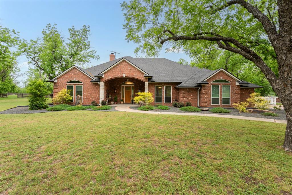 If you've been dreaming of wide-open space without giving up the conveniences of modern living, this is the one. Nestled on 3 breathtaking acres inside the gated community of Pecan Plantation, just a short drive from Granbury & under an hour from DFW, this fully renovated 4BR, 3BA home, delivers the peaceful country lifestyle you've been craving, with every luxury upgrade you'd expect in the city. Inside, the gourmet kitchen is stocked with KitchenAid appliances, granite countertops, a butler's pantry, & large walk-in pantry. The open, entertainer-friendly layout flows through two dining areas, a spacious living room & a sunroom finished with pine wood walls & ceiling. Custom cabinetry, 4 & a half inch colonial baseboards, crown molding and barn doors give rooms a warm, elevated feel — while major system upgrades including PEX plumbing, dual HVAC units, roof with solar exhaust fans, leaf-filter gutters, windows, doors, electrical, plus a full security system, mean you can simply move in & enjoy. Spa-worthy bathrooms feature a jetted master tub with heater, an oversized Jack & Jill tub, all-new tile, fixtures, and glass shower doors. The oversized laundry room with sink & attached 3-car garage round out the practical side of this extraordinary home. Step outside & you'll forget you ever needed the city. Backyard centers around a sparkling saline pool & right beside it, a stunning 1,200 sq ft pool house complete with a custom kitchen, beverage fridge, ice maker & full bath. Workshop with electric, sink & roll-up doors makes it equally functional. Mature pecan trees, lush landscaping, full irrigation, RV parking, & horses allowed complete your private retreat. And when you do want to venture out? Pecan Plantation delivers. Enjoy 24-7 gated security plus an unparalleled lifestyle with golf, swimming pools, tennis, pickleball courts, fine dining, pharmacy, bank, car wash, grocery store & more, all without leaving the gates. Come see it, Life happens here!
