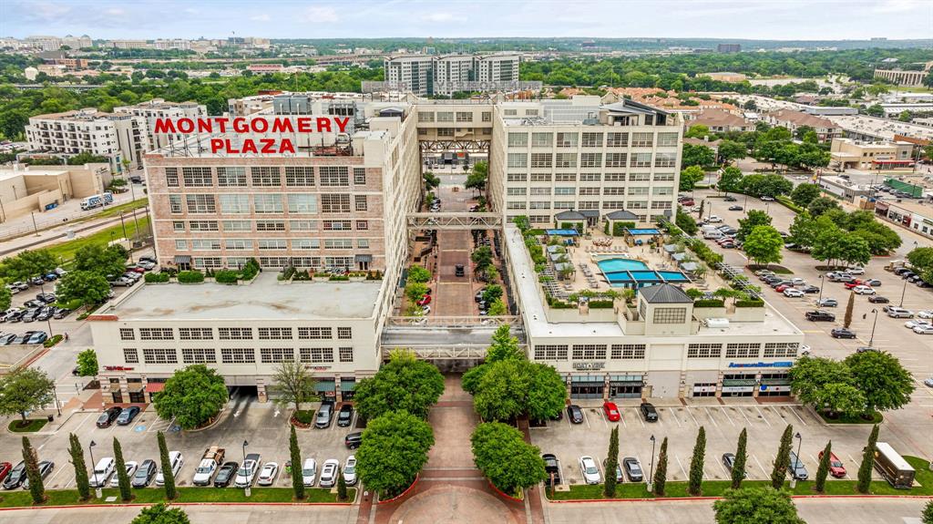 Welcome to 2600 W 7th Street, Unit 1415, where Fort Worth history meets effortless luxury living. Originally the iconic Montgomery Ward building, Montgomery Plaza has been transformed into one of the city’s premier condominium communities while preserving its distinctive architectural character. This beautifully appointed residence features a smart split-bedroom floor plan with a private guest bedroom and adjoining bath that could also be a perfect work-from-home space. The stylish kitchen offers stainless steel appliances, sleek cabinetry, and generous workspace, opening seamlessly to the spacious living and dining areas. Electronically controlled window treatments make it easy to adjust the natural light and privacy with the touch of a button. The relaxing primary bedroom includes a spa-inspired bath with dual sinks, a walk-in shower, and generous closet space. A washer, dryer, refrigerator, and armoire convey, along with two dedicated parking spaces. Beyond your front door, enjoy resort-style amenities including a rooftop pool and spa, outdoor kitchens and grills, cabanas, putting green, cornhole, media room, resident lounge, fitness center, gated dog walk, and 24-hour concierge and security. The pool is currently undergoing an exciting remodel and will soon be even more stunning than shown in the photos! All of this is ideally located near the Cultural District, Dickies Arena, Will Rogers Coliseum, the Fort Worth Zoo, Botanic Garden, museums, shopping, dining, and entertainment. Historic style, modern comfort, and an unbeatable Fort Worth lifestyle—it’s all here!