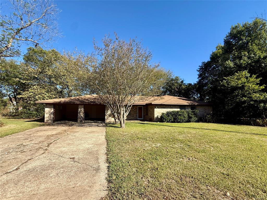 Investors or buyer's wanting to build equity will want to notice this 3 bedroom house on Main Street near downtown Cumby! This home offers potential as a rental income or for turning into a business space. For future equity, a homeowner can apply elbow grease, renovate, and update the property to increase the home's value. The 2-car attached carport could easily be converted into an enclosed garage. A small foyer leads to the living room where the dining room adjoins with an access to the backyard. The kitchen provides lots of countertop space, a breakfast bar, and plenty of storage. From the backyard, a chain link fence plus a treed lot give you shade and room to let your pets roam. Priced to sell only a couple blocks from the center of Cumby!