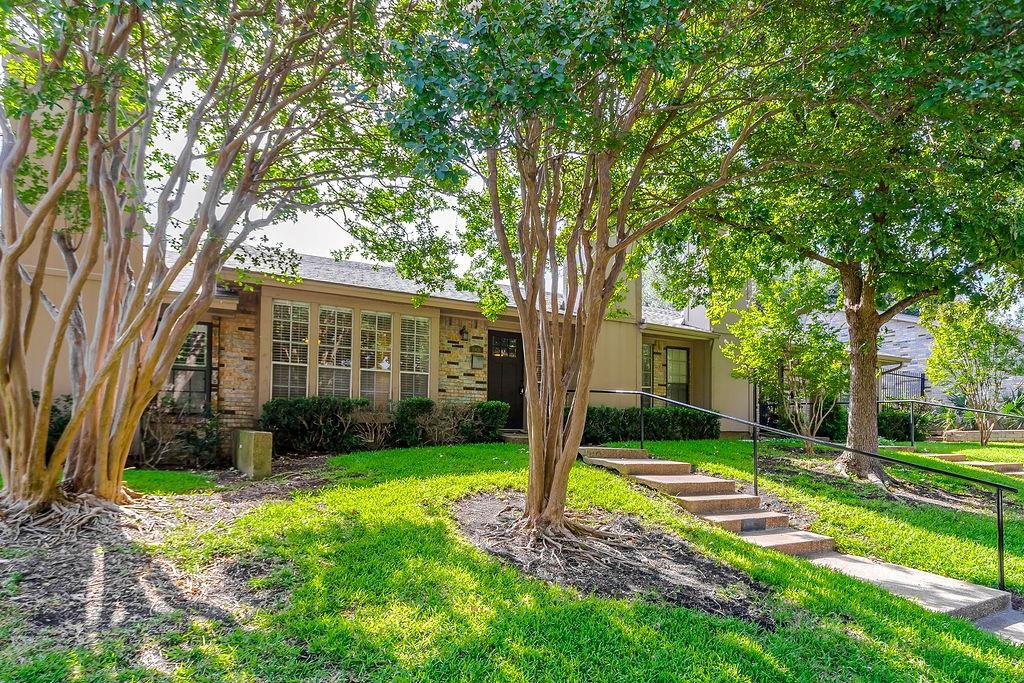 This prime North Dallas single-story townhome offers the perfect combination of style, convenience, and low-maintenance living. The open-concept living area features a cozy fireplace and flexible space for both living and dining, while the eat-in kitchen provides an additional casual dining option.  
The spacious primary suite includes an ensuite bath, two closets, and ample room for a sitting area or home office workspace. All bedrooms are spacious.  Fresh interior paint, new crown molding, and luxury vinyl plank flooring throughout create a cohesive flow of the home.  The galley kitchen features freshly painted cabinetry and is ready for immediate move-in. For added convenience and security, the private fenced patio provides direct access to two side-by-side covered parking spaces. Parking is  located behind a gated entrance for added security.  Community amenities extend your living space with access to a clubhouse, and swimming pool. The HOA enhances the low-maintenance lifestyle by maintaining the front yard, including your mature oak and crepe myrtle trees.  This home presents an exceptional opportunity in a highly desirable location. Enjoy easy access to US-75, I-635, the Dallas North Tollway, NorthPark Center, Central Market, Trader Joe's, Whole Foods, SMU, Downtown Dallas, Love Field, and more! The property also has quick and easy access to urban hiking and biking trails.
