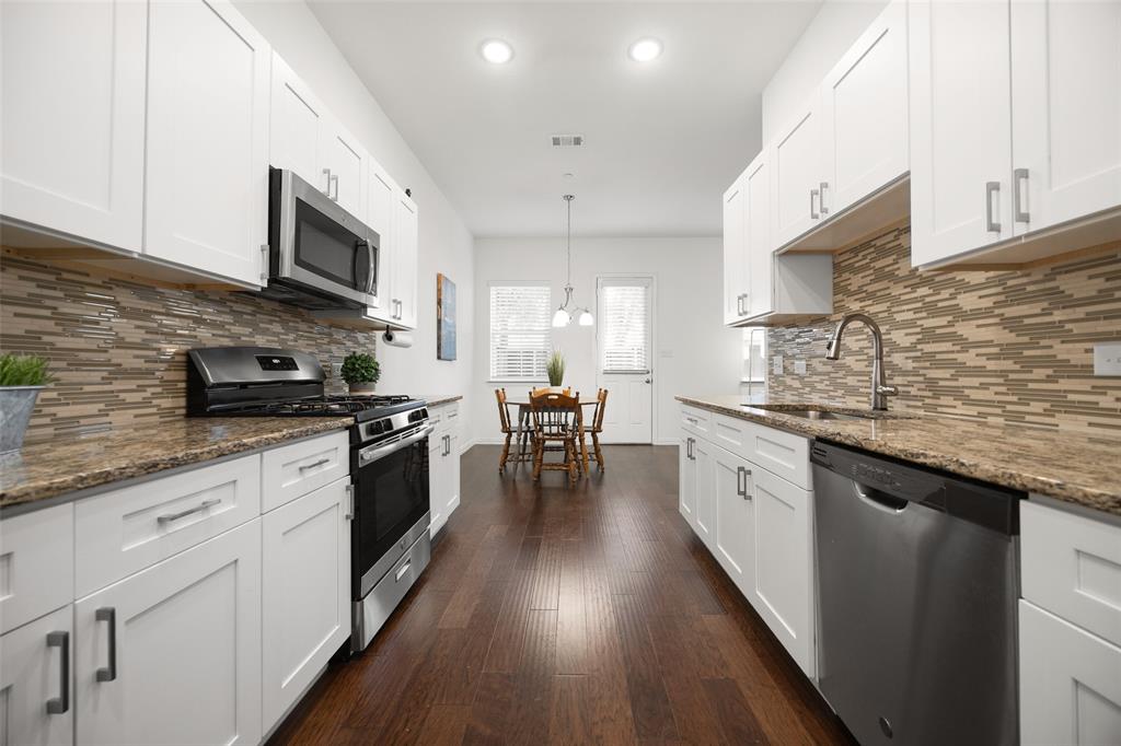 Looking for a home that is super LOW MAINTENANCE? In this community, the HOA fee covers exterior aspects of the home such as the roof, gutters, fence, irrigation, brickwork and mowing etc. Perfect for the busy professional or an investor looking for an amazing rental opportunity. Not to mention, this home still includes a 10 yr structural warranty with the builder. This townhome offers the perfect balance of space, style, and a location that keeps you connected. Designed with a thoughtful, open floorplan and modern convenience in mind, this home feels as functional as it is inviting. Enjoy a lifestyle of convenience where everything you need is right around the corner. You are in walking distance to Armstrong Elementary, grocery, and dining and just minutes from shopping and entertainment at Firewheel Town Center and major highways. With four bedrooms and three full bathrooms, there is plenty of room for everyone. Rare for a townhome, one full bedroom with ensuite is located on the main level—perfect for guests or private office. Also on the main level you have a beautiful open kitchen with SS appliances, gas range and granite countertops, pantry and plenty of cabinet space.  Upstairs you'll find three bedrooms, a guest bath and a second living space to use as you please. Inside the primary suite is an ensuite with double sinks, water closet, and large tub and shower combo. The primary also features built in shelving, walk in closet and a private balcony. Let's not forget the two car garage that has extra storage space and room for an extra fridge or freezer. This townhome also showcases a private backyard, with no rear neighbors, that has a patio perfect for grilling.  First impressions matter, and this home shines with brand-new sod and professional landscaping.