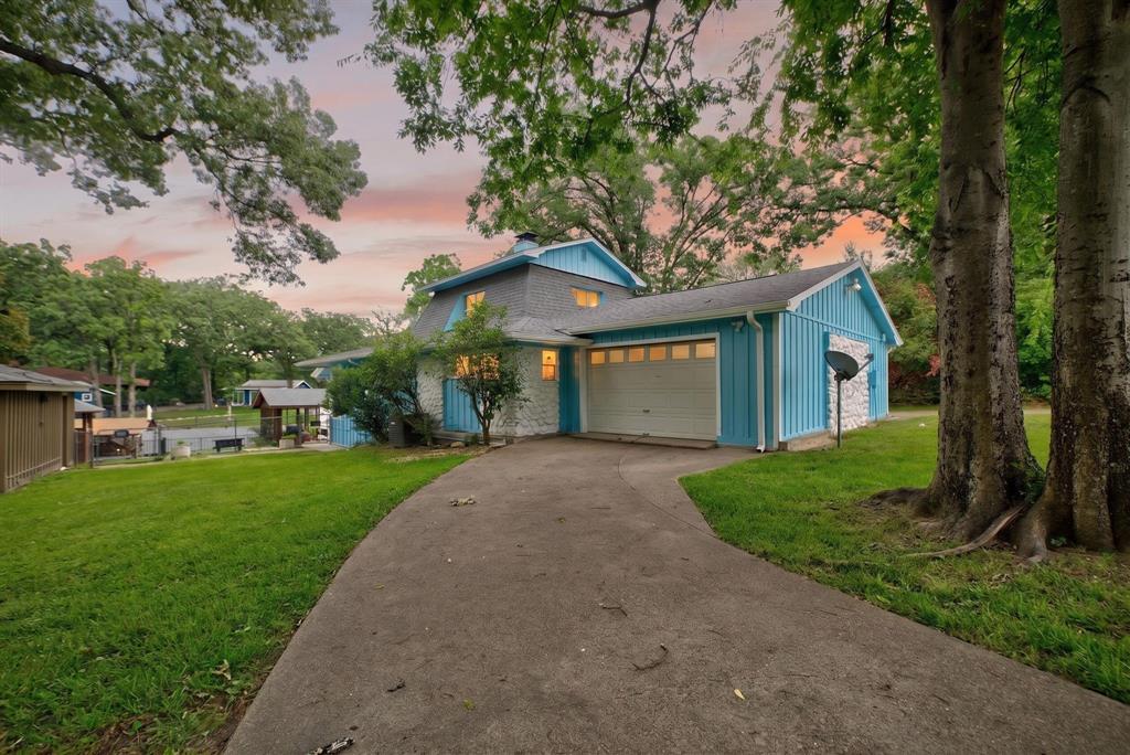 AIR BNB READY - ALL FURNITURE TO CONVEY WITH ACCEPTABLE OFFER! Enjoy waterfront living on Cedar Creek Lake! This Mabank retreat offers the lake lifestyle buyers want with flexible space, storage, and outdoor living. The welcoming living room features updated LVP flooring, thoughtful built-ins, and a fireplace that gives the home a comfortable gathering space. The spacious kitchen offers tons of cabinetry, a breakfast bar for busy mornings on the go, and easy flow into the formal dining area. The downstairs primary bedroom adds convenience, while updated bathrooms include new vanities, shower inserts, and sliding glass doors. Additional bedrooms provide comfortable space, and the upstairs bonus area creates room for your home office, second living area, or media room. A basement, garage with extra storage, shop, additional covered parking, & two electric meters add function and investment appeal. Enjoy the covered back patio, gazebo, and double-slip boat dock right on the water. Mabank is a favorite Cedar Creek Lake community known for recreation, bass fishing, and easy access to surrounding lake towns. Claim Your Piece of Texas!