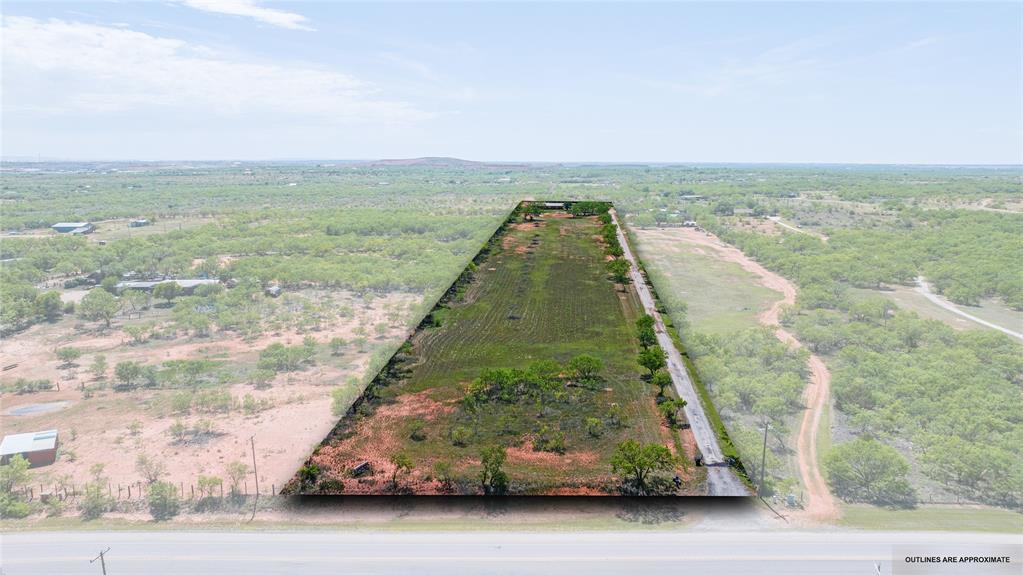 Looking for a home outside the hustle and bustle of the city that is still close enough for easy access to necessities? You have found it here. Just a little over 7 acres total. The front portion of the land is in the city limits. The house is built just outside of the city limits on the back portion of the property. There is a partially fenced area at the back that could work for a few animals or equipment storage.  Step insid ethe home into a welcoming living room with a fireplace. An office is located just left of the front door if you choose to work from home. Allowing access for the occasional customer or client without bringing them deep into the house.  Continue down the hall to the bedrooms and guest bath.  Go throught he living room to the kitchen, dining room and laundry room. The living room also offers access to the added den that could be a traditional family den or a larger entertainment area for you and your friends.  There is some work to be done, come check it out for yourself.