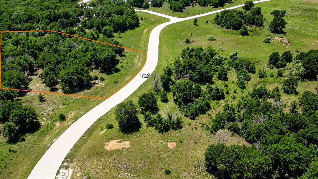 Build your dream home on this premium 2.06-acre lot in the desirable subdivision of The Reserve at Shadle, nestled in the quiet and scenic community of Poolville, TX. Conveniently located just a short drive from Weatherford and Fort Worth, this property offers the perfect setting for a peaceful weekend retreat, modern ranch-style home, or private full-time residence.

Surrounded by mature, towering trees, the lot provides exceptional privacy from neighboring properties in every direction while still offering plenty of open space to design and build your ideal home. The community features a paved concrete road, with underground electricity and fiber available at the street.

Water well and septic installation will be the buyer’s responsibility. City of Poolville building codes apply. No mobile homes allowed.