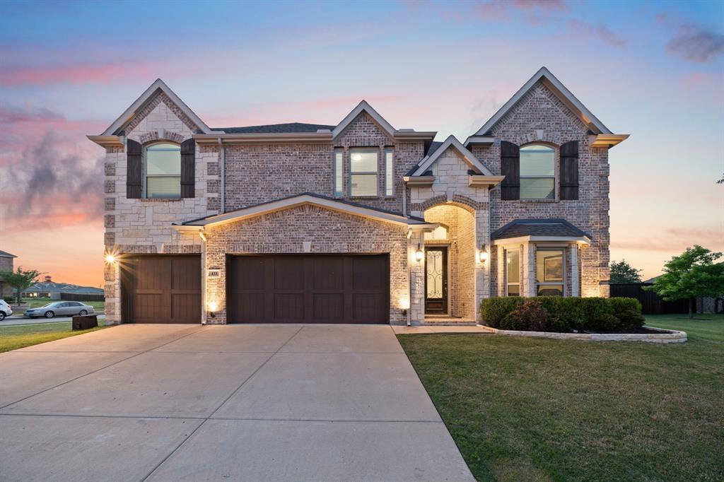 Situated on an oversized 0.34-acre corner lot, this stunning home—built by First Texas Homes—features a beautiful pool with water features, perfect for outdoor enjoyment. The striking stone-accented elevation and inviting front porch create a grand first impression, complemented by a glass and wrought iron front door and a full smart home and Brentwood wiring package. Additional upgrades include exterior uplighting and a custom media room with dark paint and sconce lighting for a true theater experience.

Step inside to a grand entry with a curved staircase and iron balusters, leading to a dedicated private office with French doors and an elegant formal dining room. The open-concept living area boasts soaring ceilings and a dramatic two-story stone fireplace, creating the perfect space for entertaining.

The gourmet kitchen blends style and function with granite countertops, a gas cooktop, double ovens, an oversized island with breakfast bar seating, a butler’s pantry with glass-front cabinetry, and a walk-in pantry.

The primary suite offers a spa-inspired retreat with dual vanities, a soaking tub, separate shower, and a large walk-in closet.

Upstairs, you’ll find a spacious game room, media room, and four generously sized bedrooms—each with walk-in closets—along with two full bathrooms, including one with a convenient Jack-and-Jill layout.

Throughout the home, enjoy ceramic tile flooring, a full bathroom downstairs, and a large utility room for everyday convenience. The 3-car garage adds both functionality and storage.

Step outside to a covered patio overlooking the sparkling pool, creating a true backyard oasis.

Zoned to the new Themer Middle School and located just one mile from the highly anticipated Bellagio Lagoon, residents can enjoy a resort-style destination with crystal-clear waters and world-class amenities—accessible with a day pass.

Don’t wait—schedule your showing today!