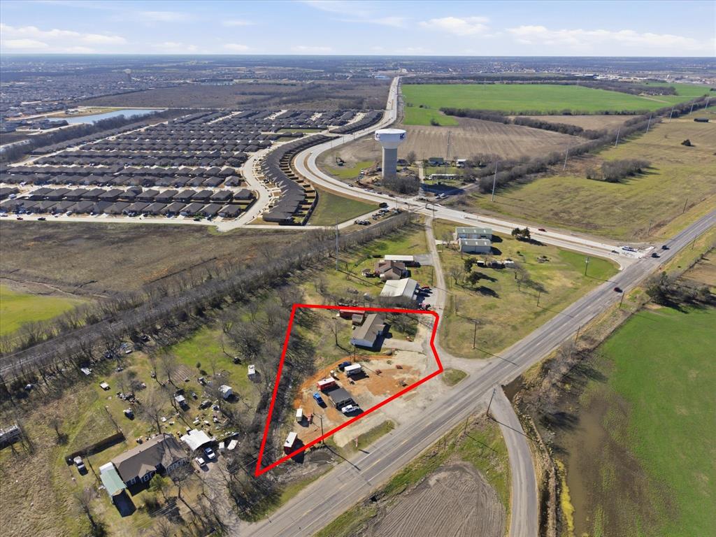 Exceptional opportunity to acquire this 1.1-acre tract ideally positioned just north of FM-2642 on State Highway 66, with over 200 feet of highway frontage. Live in the residence and run the food truck business! The house needs TLC and foundation repairs, it's currently leased as retail (interior photos are from before it was leased). This high visibility site benefits from a daily traffic count of 10,000+ vehicles, making it a strategic investment within a rapidly expanding community. Just minutes from Buc-ee's, Walmart, Lowes and other major retailers; Royse City's historic Main Street; and the future Royse City Town Center development at I-30 & FM-2642 with highly anticipated anchors. This unincorporated parcel is located outside city limits and the ETJ, with no floodplain, allowing for a wide range of development opportunities. The property includes an income generating, fully leased 7-space food truck court with electric and water connections. Current income: $6150 monthly, $73,800 annually. This property is positioned for long-term growth and flexible use potential for investors looking to capitalize on this area's explosive expansion. The 2 parcels are in the process of being replatted into a single address and parcel, will not sell separately. Subdivided listing: Main Commercial Listing MLS#21187569.