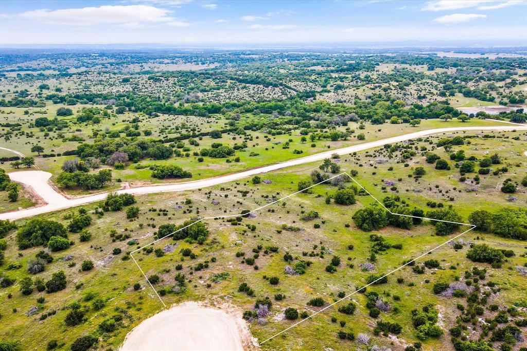 Discover Hidden Valley Ranch, Somervell County’s Premier Acreage Gated Community!  Just a short drive south of Glen Rose, Hidden Valley Ranch offers a peaceful retreat in one of the area's newest residential developments. These expansive acreage lots provide stunning views and a sense of privacy, ideal for those seeking a quiet escape with room to roam. Enjoy the community’s private park featuring a scenic pond, perfect for fishing or relaxing afternoons under the pavilion with picnic and grilling areas. UCS supplies both electric service and high-speed fiber internet, ensuring modern conveniences in a rural setting. Additional amenities include gated entrances, community mailboxes, and well-maintained chip-seal roads.
Lot 137 is a standout—4.21 acres perched on a hilltop with panoramic views, mature oak trees, and a flat, ready-to-build homesite. Watch the sunrise, enjoy abundant wildlife, and experience true Hill Country living. All this, and it's located within the highly rated Glen Rose ISD.  You'll also benefit from lower county tax rates—don’t miss your opportunity to build your dream home in Hidden Valley Ranch!