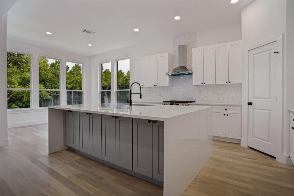 Discover this stunning, fully remodeled modern home where sleek design meets effortless living. This spacious 5-bedroom, 3-bathroom residence with a 2-car garage has been thoughtfully updated from top to bottom, featuring rich hardwood floors that flow throughout the open-concept layout—creating a warm yet contemporary ambiance perfect for both entertaining and everyday living.
The heart of the home is the gourmet kitchen, highlighted by dramatic waterfall quartz countertops, a large central island, high-end stainless steel appliances, and a dedicated wine enclosure for the discerning collector. Natural light floods the expansive living areas through oversized windows, accentuating the clean lines and premium finishes.
The primary suite offers a true retreat with a spa-like bathroom featuring a beautiful walk-in shower with frameless glass, designer tilework, and a rainfall showerhead. The additional four bedrooms provide flexibility for family, guests, or a home office, while the three full bathrooms ensure convenience for everyone.
Additional highlights include pre wired movie theater room, energy-efficient updates, modern lighting, ample storage, and a private backyard perfect for relaxation or gatherings. Whether hosting in the open living spaces or unwinding in luxury, this home delivers comfort, style, and sophistication in every detail.