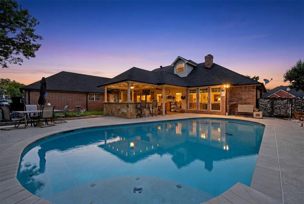 This is the ultimate example of family living!  No detail was spared in the creation of this property, from the backyard oasis featuring a fully covered outdoor kitchen, open patio, sunroom, and convenient pool bath to the spacious lawn area for the family pets. This property is designed for extended families to build memories while enjoying the privacy of their own suites, offering ideal accommodations for guest, adult children, aging parents or live-in caretakers. The thoughtfully designed layout provides generous living and entertainment space, including large family rooms, formal gathering areas, and well-pointed kitchen with abundant storage and workspace. Exceptional storage, spacious bedrooms, and versatile living areas allow this home to easily adapt to a variety of lifestyle needs. Whether you’re seeking a home for a growing family, accommodating multiple generations under one roof, or simply desiring room to spread out, this remarkable property delivers the space, functionality and flexibility you’ve been looking for, along with endless opportunities for outdoor enjoyment. All information deemed reliable, but not guaranteed.