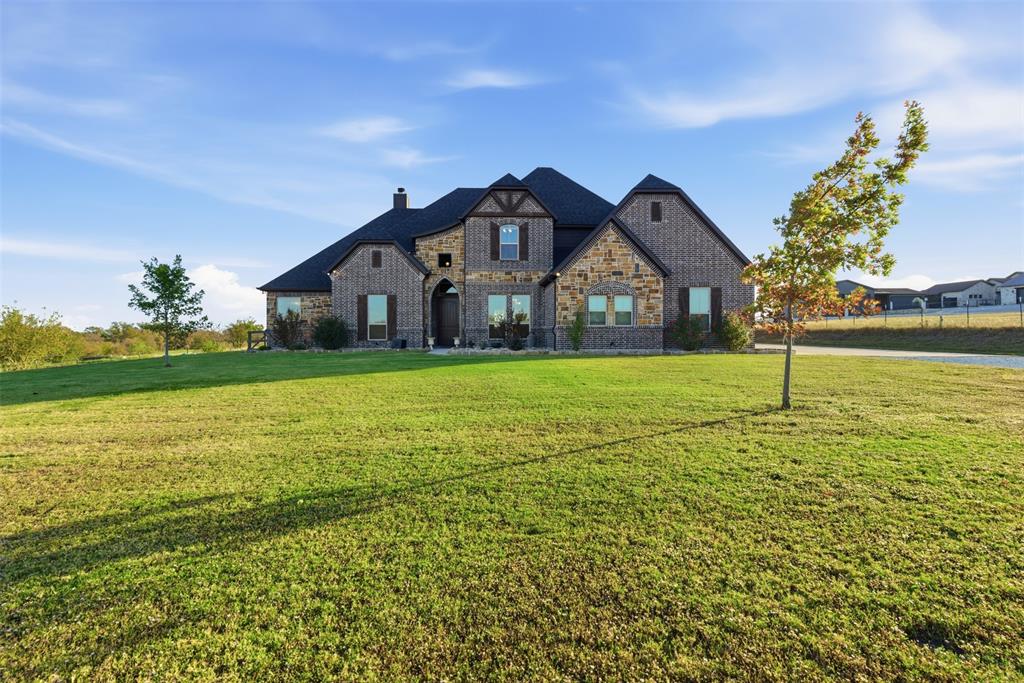 Stunning blend of luxury, space and privacy in this estate with hilltop views on 10 gorgeous rolling acres nestled privately in the country!  Designed by the sellers and built by Truth Construction the property features a main home and attached mother in law suite with private entrances all with panoramic views of the sunrise over a private pool and outdoor entertainment area.  Quiet comfort and close to I35, schools, Lake Ray Roberts and convenience to entertainment and shopping. Upscale design throughout this home with upstairs quiet privacy with 2 bedrooms and full bath and a gameroom and office area providing functionality for the owner to have endless options.  Primary bedroom has private location on first floor with massive walk in closet and large views looking over the estate.  Second first floor bedroom is privately situated with full bath.  Open floorplan with large kitchen and island and informal dining and living area all with beautiful countryside views and exiting into your relaxing pool and patio oasis.  Well designed kitchen is a chefs paradise with lots of counter space, cabinet storage, two ovens and large walk in pantry.  Formal dining has functionality to be large office suite for the work from home owner or second gameroom area for the large family.  The luxurious mother in law suite is a full 2 bedroom 1 bath with private entrances, a spacious open kitchen with island and large living area and it's own oversized laundry room with built ins.  Outdoor pool and entertainment area has sweeping countryside views and large patio on the main house and large private patio on the mother in law suite.  A short walk to the insulated shop allows for hobbies and storage of all needed equipment to maintain your estate and the perfect spot for all your fishing equipment which you will need for your stocked pond a short walk south of the home and barn.  Gated private entrance with quiet privacy and off a paved county road makes this luxury estate one to see!