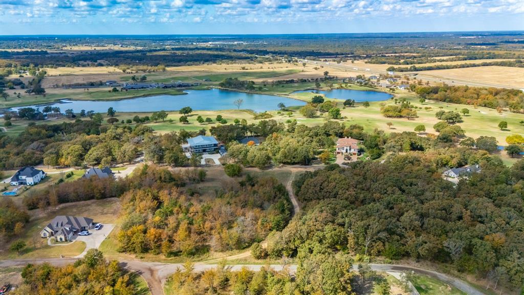 In the community of Country Club Estates, this wonderfully wooded 1-acre lot sits within walking distance to the golf course! Enjoy resort-like living in this quiet neighborhood while being a golf cart away to Country Club amenities that includes a swimming pool, restaurant, fitness center, fishing, and an 18-hole golf course. Surrounded by beautiful newer homes, build your dream place and create a backyard oasis under a wooded canopy. For more recreational fun, take advantage of nearby lakes such as boating on Lake Cypress Springs, fishing on Lake Bob Sandlin, Lake Fork, and camping at Cooper Lake State Park or Bob Sandlin State Park. Or drive within minutes to the vibrant and beautiful downtown plaza with shopping, boutiques, dining, and annual events on the square. All this conveniently located near Interstate 30, only 1.5 hours from Dallas!  Buyer is required to maintain a membership to the SSCC as soon as their home has been completed.  Currently $350 initial fee and $110 per month for social membership.  Memberships vary.  CC Estates currently has no HOA established, or fee.  See docs.  Brinker Water Supply current meter cost $2,900 Buyer and Buyer's agent to verify all information.