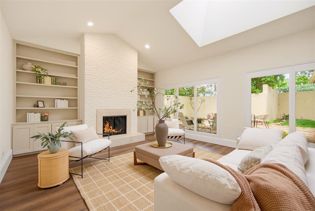 Location, Location, Location. Tucked between the coveted neighborhoods of Bluffview and Preston Hollow, this fully reimagined townhome offers the perfect blend of style, privacy, and convenience, with central access to some of Dallas’ best dining, shopping, and entertainment. A rare opportunity to own an end-unit within this charming community, the home is nestled in the peaceful Cochran Chapel Circle cul-de-sac, where mature trees and established landscaping create a welcoming, neighborhood feel from the moment you arrive. An attached two-car garage and oversized driveway provide ample parking for guests, while the oversized backyard, shaded by mature trees and complemented by a covered patio, offers the perfect setting for entertaining, relaxing, and enjoying al fresco evenings.

Inside, the home has been completely refreshed with luxury vinyl plank flooring, stunning Taj Mahal quartzite countertops, stainless steel appliances, and thoughtfully curated designer touches throughout. The light-filled living room makes an immediate impression with soaring vaulted ceilings, a dramatic skylight, and a timeless brick fireplace that anchors the space with warmth and character.

The spacious primary suite is conveniently located on the main floor and offers direct access to the private patio, creating the perfect indoor-outdoor connection. The gut renovated primary bathroom feels like a true spa escape with a large soaking tub, separate walk-in shower, and elevated finishes throughout. A secondary bedroom and full hall bathroom are also located downstairs, offering the ideal setup for guests, a home office, or flexible everyday living.

Upstairs, a private third bedroom retreat awaits with its own beautifully renovated en suite bathroom, making it perfect for visitors, roommates, or multigenerational living. Every space has been thoughtfully updated while maintaining the character and charm that make this home truly special.
