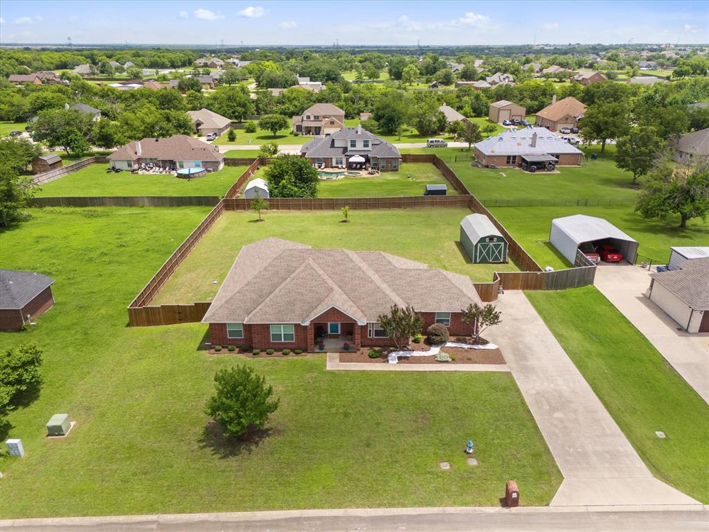 Welcome to 112 Northview Drive—where space, freedom, and small-town charm come together on an almost one half-acre homesite with NO HOA!
Nestled in the established Northview Village community, this beautifully maintained single-story home offers comfort, functionality, and plenty of space for outdoor living. Featuring 3 spacious bedrooms, 2 bathrooms, and flexible living spaces, this home is designed for the way today's buyers live. Step inside and notice the large flex room perfect for  dining or office.  The bright and airy eat-in kitchen offers an abundance of cabinetry, generous counter space, and island and overlooks the large living room and breakfast area.The oversized primary is a true sanctuary, complete with a walls of windows overlooking the backyard and a beautiful ensuite bath. The heart of the home opens seamlessly to the expansive backyard through  double doors, creating an indoor-outdoor lifestyle. Whether you're dreaming of a pool, workshop, garden, RV parking, outdoor entertaining space, or simply room to roam, this incredible half-acre lot delivers endless possibilities. Home includes several updates in recent years to include flooring in living and large flex room and newer windows and fencing.  A long driveway leads to a double-gated backyard entrance, while the side-entry garage offers ample space for vehicles, recreational toys, trailers, and additional storage. Large building in back yard is perfect for storage! Location is everything, and this home delivers. Enjoy the convenience of being just a short walk to the elementary school and Joe Burger Park, with easy access to shopping, dining, and everyday amenities. Homes offering this combination of land, privacy, updates, and freedom from HOA restrictions are increasingly hard to find. If you've been searching for a property with room to live, play, and grow, schedule an appointment and check out this beautiful home!