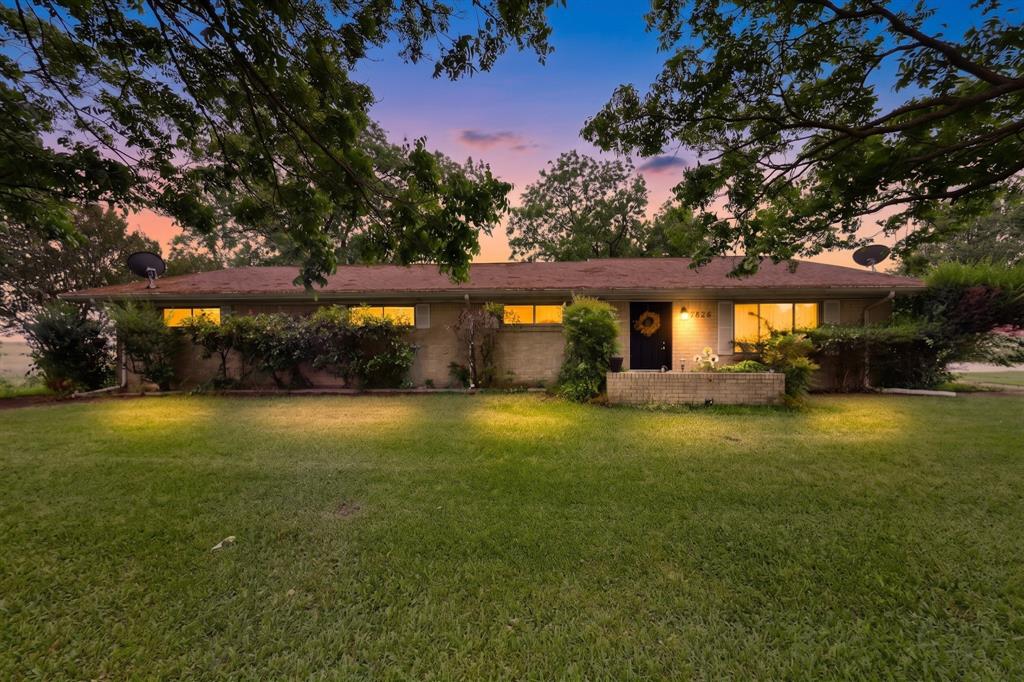 Welcome to a place where mornings start with quiet breezes through the trees and evenings end on a deck overlooking your own private slice of the countryside. This charming single-story brick home sits behind a gated entrance, surrounded by mature shade trees and wide-open green space that gives you room to breathe, unwind, and truly settle in. Inside, the home feels warm and lived-in, with luxury vinyl flooring, a cozy living area, and a kitchen designed for everyday comfort. The bedrooms offer peaceful retreats, and the bathrooms blend classic charm with modern updates, including a beautifully tiled walk-in shower that elevates the space. Step out back, and you’ll find the heart of country living: a spacious deck strung with lights, perfect for gatherings, quiet mornings, or watching the sun dip behind the trees. Multiple outbuildings, including a workshop with covered areas, give you space for projects, storage, equipment, or hobbies. An oversized garage and carport add even more flexibility. From above, the property reveals its full beauty: open fields, scattered trees, a nearby pond, and the kind of rural setting that feels worlds away while still being connected. Whether you’re looking for privacy, space, or a peaceful retreat, this home offers a lifestyle that’s hard to find and easy to love.

All information deemed reliable but not guaranteed.
