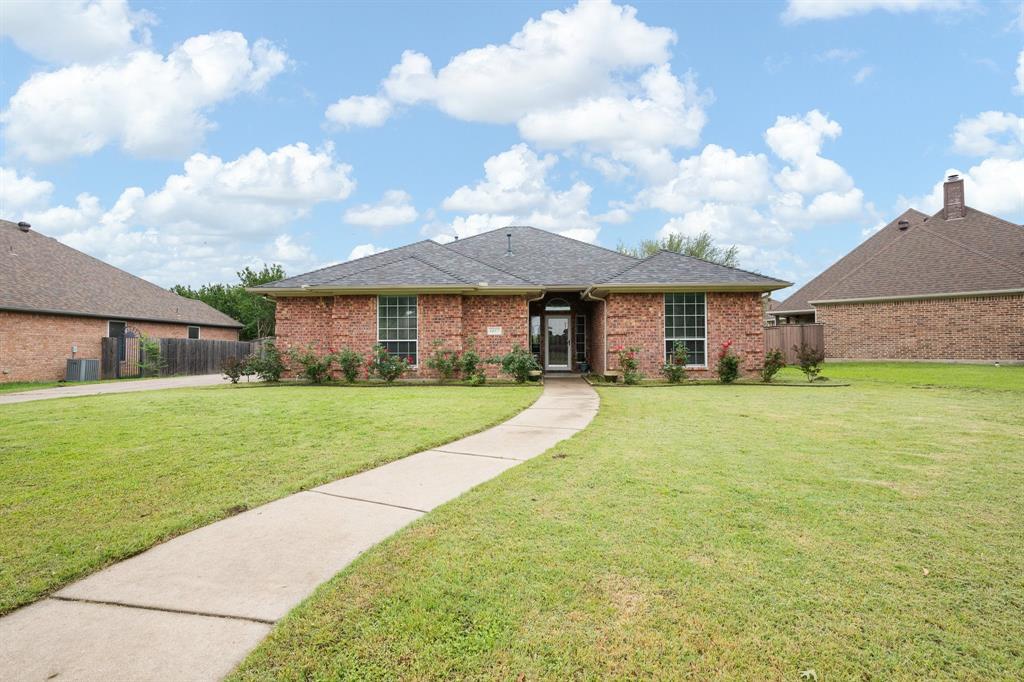This charming home is located in a well established neighborhood and offers 3 bedrooms, 2.5 bathrooms, and a convenient side entry garage. The oversized backyard is a standout feature perfect for children to play and with ample space to add a swimming pool. The spacious open floor plan creates a welcoming atmosphere, with a cozy gas fireplace serving as the focal point of the living room. The kitchen provides abundant cabinet space, including lighted glass-front cabinets ideal for showcasing your favorite pieces.  The appliances have been updated and the kitchen offers a cute coffee bar space. The dining area features a large window that overlooks the backyard and fills the space with natural light. The primary suite is generously sized and includes dual vanities, a large soaking tub, and a separate walk in shower. The impressive 7x13 walk in closet offers exceptional storage.  
Residents will also enjoy access to a neighborhood playground, providing a convenient place for outdoor fun.  The house is also walking distance to the elementary school and intermediate school. A new roof was installed in 2025 and the HVAC was updated in 2021.