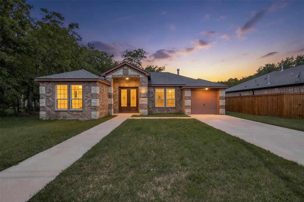 Welcome to 343 N Morris St, a modern 2021-built home in Gainesville, TX featuring a rare private-entry suite that opens the door to possibilities rarely found in newer construction. Whether you're accommodating extended family, creating a private space for guests, working from home, or exploring future rental income, this flexible area is ready to adapt to your needs. Complete with its own exterior entrance, utility area, additional sink-vanity, and refrigerator, it offers a level of versatility that sets this home apart.

Inside, you'll find bright, open living spaces designed for both comfort and connection. Natural light fills the home, while the kitchen serves as the heart of the layout with stainless steel appliances, abundant cabinetry, and easy flow into the dining and living areas. The stone-and-brick exterior creates timeless curb appeal, and the backyard offers plenty of room to relax, entertain, or enjoy time outdoors.

Located just minutes from historic downtown Gainesville, local dining, shopping, and Lake Ray Roberts, this home combines modern living, everyday convenience, and the flexibility today's buyers are searching for.