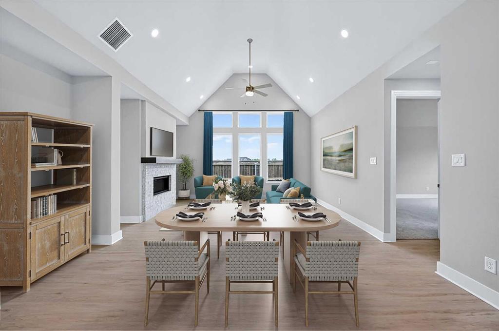 This exquisite home offers over 2,600 sq. ft. of thoughtfully designed space all on one floor. A striking modern exterior welcomes you with light brick,black roof,covered front entry,and a cedar garage door. Inside,the open dining and family rooms boast 16-foot vaulted ceilings,a gas fireplace and covered patio which accommodates private relaxation or large gatherings. The heart of the home impresses with a chef-inspired kitchen. Retreat to the secluded primary suite,offering a spa-like bath with a soaking tub,separate shower,dual sinks,and a walk-in closet.