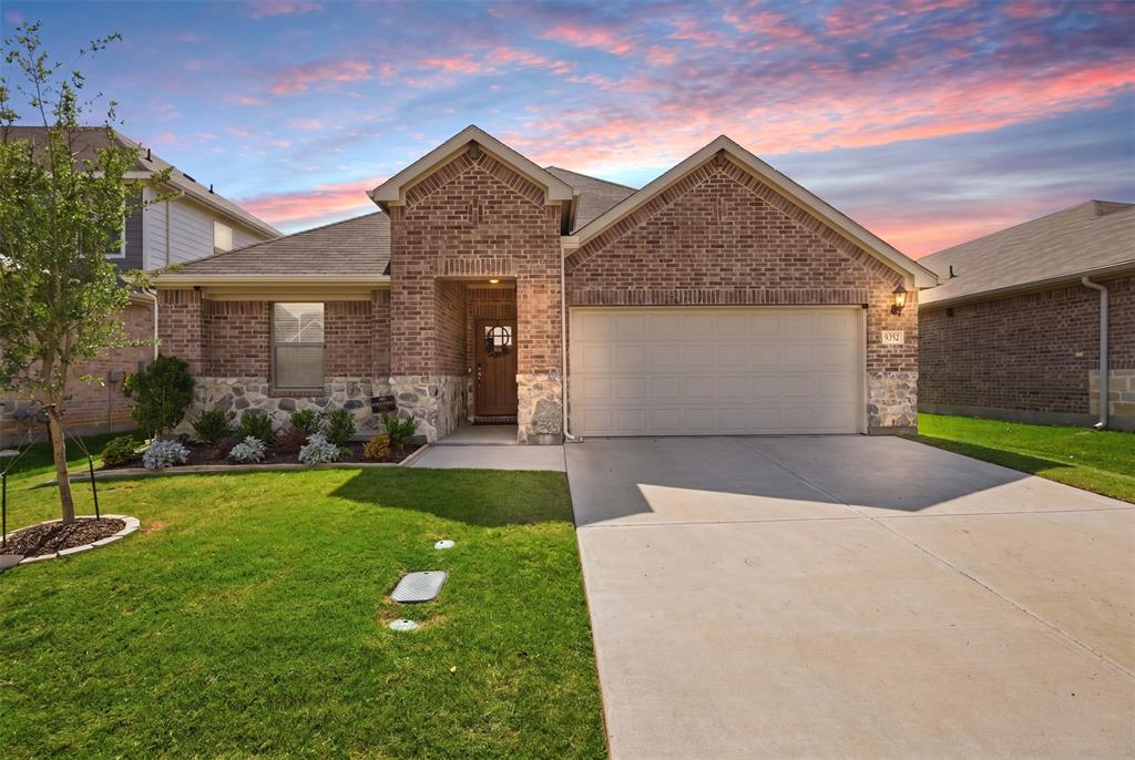 Discover this breathtaking, better-than-new 2024-built home nestled on a lot with views of rolling hills in the beautiful 600-acre master-planned community of Chisholm Trail Ranch. Offering all the upgrades without the wait of new construction, this home has been designed to blend modern style, functionality, and exceptional value in one incredible package. Once inside, you’re welcomed by sweeping wood-look LVP flooring that extends through the main living areas. The entry opens to a light-filled, open-concept space where the living room, kitchen, and dining area flow seamlessly together. A wall of windows along the back of the home fills the space with natural light, creating an open and airy feel throughout. The gourmet kitchen serves as the heart of the home, featuring sleek Whirlpool stainless steel appliances, a gas range, quartz counter-tops, two-toned oversized island with added trim detail, and a spacious walk-in pantry. A versatile flex room offers endless possibilities and can easily function as a formal dining room, home office, playroom, media room, or additional living space to suit your needs. Tucked privately at the back of the home, the primary suite provides a quiet retreat with an ensuite bath complete with dual sinks, a large walk-in shower, linen closet, and generous walk-in closet. The thoughtful two-way split-bedroom layout ensures comfort and privacy for everyone, including a private secondary bedroom with its own ensuite bath and walk-in closet. Two additional bedrooms share a well-appointed full bath with a linen closet. An oversized separate laundry room adds everyday convenience with ample space for folding, storage, and organization. Ideally located with easy access to highways, shopping, and dining, you’ll also enjoy nearby trails, parks, and the historic Fort Worth Stockyards just a short drive away.