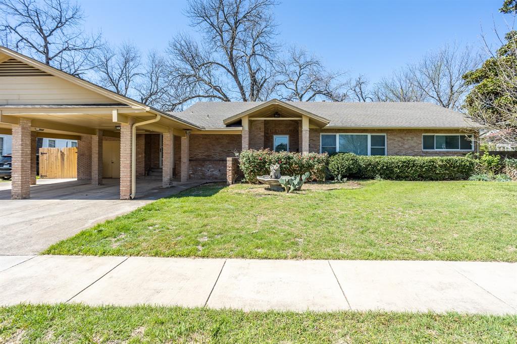 LOOKING FOR A UNIQUE MID CENTURY IN HISTORIC DISTRICT? This could be the one you where you can make your own. House has solid bones.  Brick, pier & beam. Several years ago windows were replaced and flat roof raise for a pitch. Owner recently had licensed electrician update as needed all the electric. Walk into large living with big picture window to see front yard but also from the front you can see the back yard too.  Second living has wall of windows overlooking back yard and to the side is the kitchen with bar for serving. Electric cook top, oven, dishwasher, farm sink, pantry, refrigerator.  French doors to a deck and bricked area with fire pit.  Bedrooms split. Master has bath with jet tub and double vanity, walk in closet plus wall of drawers. Connected to master is the office or private sitting area. Perfect for a home owned business with an outside entrance office.as outside entrance.  As you go other bedrooms there is a cedar lined closet + a closet. Bedroom area has a full bath and good closet space. The lot is long featuring more family living space.  Privacy fence brick & deck area, shade trees, storage building plus a 16x16 building with electricity for she shed, office, exercise room. Gate from drive way opens with additional concrete for cars, boats,  bikes, motor cycles, etc.   In historic district 4 blocks from 1852 Historic Town Square with shops, restaurants, live theater and regular special events.  20 minutes to downtown Dallas, 35 minutes to DFW 
or Love Field. about 3 miles to I35, I 45 and I 20 for easy access to any direction. A home that has seen 2 previous families raised great children.  Be the next one to bring love and laughter into these walls. No blinds offers