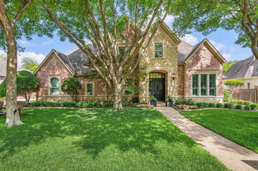 Welcome to true luxury in this fully renovated five-bedroom executive estate, nestled within Southlake’s most prestigious and only guard-gated neighborhood. Meticulously redesigned with every element of this residence which has been curated with uncompromising attention to detail and timeless sophistication. Upon entry, matt finished dark hardwood floors lead through a gallery-like interior enhanced by fresh architectural paint, designer lighting, and newly installed double-pane windows that bathe the home in natural light. A striking custom staircase anchors the modern layout, while the formal living and dining spaces offer an elegant setting for elevated entertaining. A richly appointed private study showcases bespoke millwork, creating a distinguished work-from-home environment. The expansive main living area is framed by dramatic two-story windows, seamlessly blending indoor luxury with serene views of the lush, private greenbelt beyond. At the heart of the home, the chef’s kitchen is a statement of both form and function—featuring a leathered quartzite island with 3 inch edging, a 48” Wolf range, and floor-to-ceiling custom cabinetry—flowing effortlessly into the reimagined family room. The primary suite is a secluded sanctuary, complete with a fireplace and a spa-inspired bath boasting a soaking tub, oversized walk-in shower, and an expansive custom closet. A separate first-floor guest suite with a designer ensuite bath offers exceptional privacy for visitors. Upstairs, a sophisticated game lounge with a fully equipped modern wet bar provides the ultimate retreat, accompanied by three generously sized bedrooms, each with its own exquisitely updated ensuites. Outdoors, the beautifully landscaped grounds frame a sparkling pool overlooking the tranquil greenbelt. With unmatched access to premier shopping, dining, scenic trails, and the award-winning Carroll ISD, this extraordinary residence represents exclusivity, craftsmanship, and modern luxury.