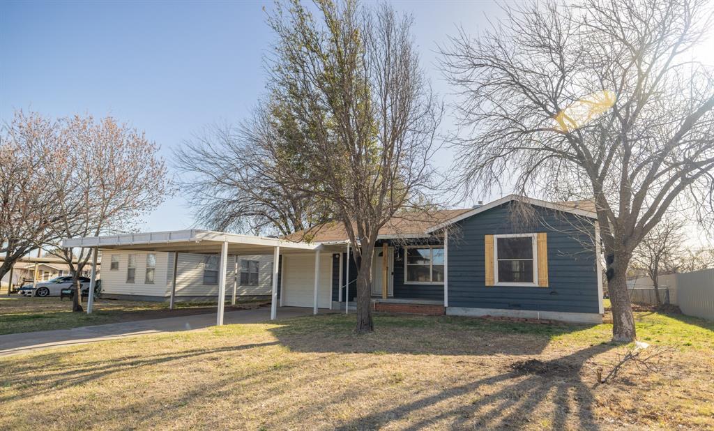 Owner Agent. This 2 bedroom, 1 bath home, located in Southwest Abilene, has multiple updates throughout, and is ready for its new owners.
The kitchen has been updated with granite countertops, an eye catching tile backsplash, stylish hardware, and is equipped with a gas range a dishwasher, and refrigerator. The 1,042 SF of living space is lined with LVP flooring which is both attractive and easy to maintain. Bedrooms are a nice size, have sufficient closet space, and have plenty of natural light. A large utility room houses the washer and dryer hook ups and has a load of built in cabinets for great storage. Outside, the spacious, fenced yard has room for your landscaping ideas, hosting guests, or just kicking back and enjoying some down time. Want to protect vehicles from the Texas sun, wind or hail? This house provides a single garage and a 2 car carport! Another Bonus is this house is equipped with a newer Class 4 roof! With great curb appeal, several awesome updates, and a nice location, this home is a great choice whether you are buying your first home, downsizing, or looking for a fabulous investment. Come check it out!