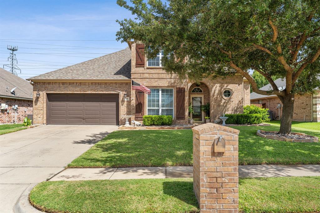 Welcome to 5540 Plata Lane, a beautifully maintained two-story home in the desirable La Bandera community of Benbrook. Backing to a peaceful greenbelt, this home offers added privacy, a sparkling pool, and a covered patio that's perfect for relaxing or entertaining. Enjoy fresh vegetables from your own backyard garden, including tomatoes, jalapeños, squash, and more. The functional floor plan features two first-floor offices, an open kitchen with an eat-in dining area, and a spacious living room with a wood-burning fireplace and built-in cabinets. The first-floor primary suite includes large windows and an ensuite bathroom with dual vanities, a soaking tub, and a separate shower with a bench and a large custom-built walk in closet. Additional highlights include a large walk-in pantry, abundant storage throughout the home, including under the stairs, and an oversized two-car garage with epoxy floors and built-in cabinets. Upstairs, you'll find two additional bedrooms, a full bathroom, and a large bonus room with built-in shelving that can be used as extra storage, a home office, or a craft room. The home also features front and back irrigation, a hot water heater less than a year old, and a refrigerator that is negotiable with a strong offer.