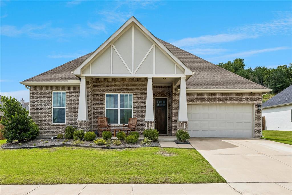 Welcome to 215 E. Furlong in the highly sought-after Reserves at Trinity community in Willow Park and acclaimed Aledo ISD. Offering 4 bedrooms, 3 full bathrooms, a flexible upstairs suite, and 2,577 square feet of thoughtfully designed living space, this beautifully maintained home was built in 2020 and sits on an impressive 0.393-acre lot with exceptional privacy and scenic views.

The open-concept floor plan features wide-plank luxury vinyl flooring, soaring ceilings, abundant natural light, and a spacious living room anchored by a cozy wood-burning fireplace. The chef-inspired kitchen is the heart of the home, showcasing a large granite island, white cabinetry, subway tile backsplash, stainless steel appliances, walk-in pantry, and generous breakfast bar seating.

The private primary suite provides a relaxing retreat with a spa-like bath featuring dual vanities, a garden tub, separate shower, and an oversized walk-in closet. Three additional bedrooms and a full bath are conveniently located on the main level.

Upstairs, you'll find a spacious bonus room with a full bath that offers exceptional flexibility and could easily serve as a 5th bedroom suite, guest quarters, game room, media room, home office, or multi-generational living space.

Step outside to enjoy the covered patio and spacious backyard. This unique property extends beyond the fenced backyard, providing additional land and a buffer of open space that enhances privacy and creates a truly distinctive outdoor setting. The oversized homesite offers ample room for outdoor entertaining, play, or future customization while enjoying the peaceful surroundings. A dedicated side-yard garden area with raised planting beds adds to the property's outdoor appeal. See survey for property boundaries.

This move-in ready home combines modern style, functional living, privacy, and a truly unique outdoor setting in one exceptional package.