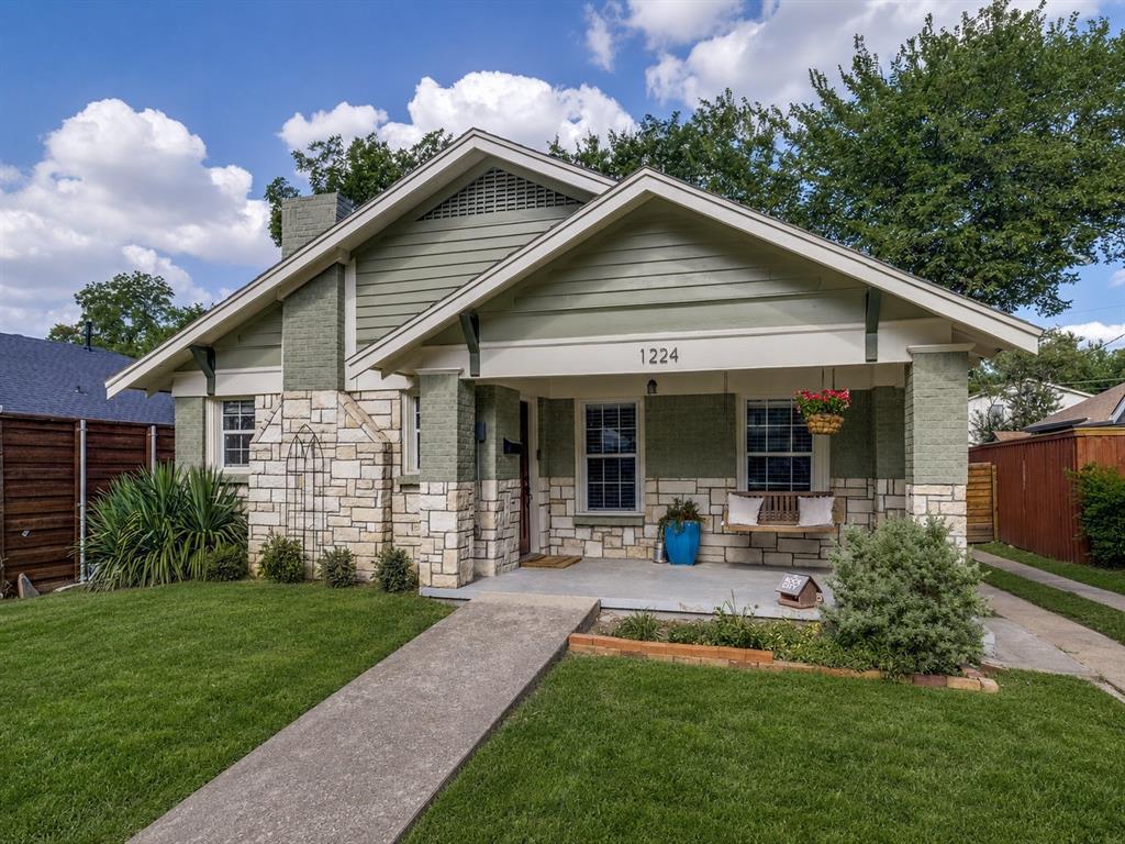 Charming North Oak Cliff cottage full of character! This 2-bedroom, 1.5-bath home features real hardwood floors, beautifully updated bathrooms, and thoughtful upgrades throughout. A detached single car garage provides plenty of space for parking, storage, or a workshop. Enjoy peace of mind with a newer HVAC system, a roof replaced approximately two years ago, and solar panels for energy-efficient living. Nestled on a tree-lined street just minutes from the Bishop Arts District, this home offers the perfect blend of historic charm, modern updates, and an unbeatable location.