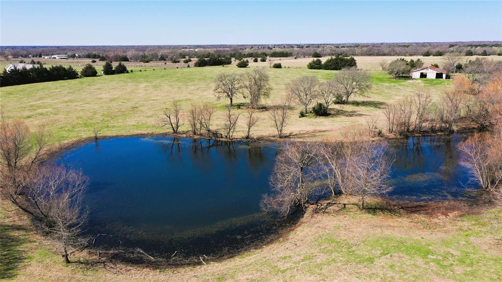 REDUCED!.... Nestled just 5 miles from State Highway 121 and conveniently off State Highway 78 in southern Fannin County, this exceptional property offers a blend of natural beauty and investment potential. The land features a gently rolling topography, highlighted by a picturesque pond ideal for fishing. Scattered mature trees dot the landscape, creating the perfect setting for a stunning homesite or a tranquil retreat.
In addition to its scenic appeal, the property is equipped with two barns, as well as fenced pastureland with rich, well-maintained grasses—ideal for livestock, or recreational use. Importantly, none of the land lies within a FEMA-determined floodplain. Moreover, the property currently holds an agricultural exemption, offering tax advantages for those looking to maintain the land for agricultural purposes.
Whether you envision it as a private homesite, a long-term investment, or a peaceful getaway, this property offers exceptional value and endless possibilities. See the aerials, soils maps, etc. that are posted in the supplements.