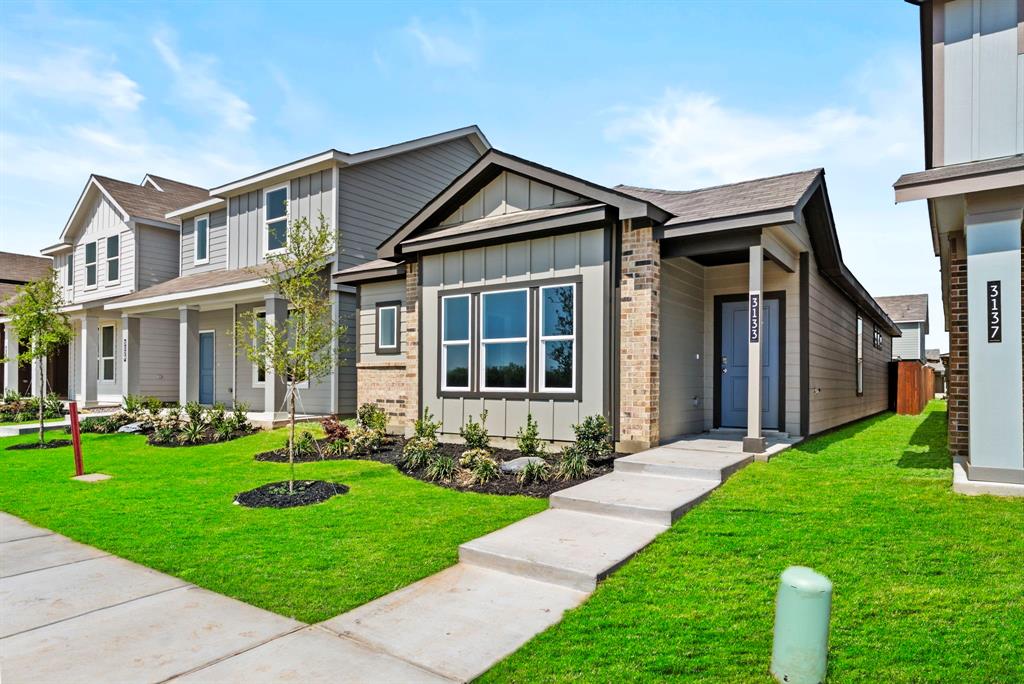 5% lender incentive offered with the use of the seller’s in-house lender, Homeward Mortgage! Incentive may be used towards buyer closing costs and or rate buy-down, subject to lender approval and buyer qualification.
The Acorn is a smartly designed single-story home offering approximately 1,300 sq. ft. of living space with 3 bedrooms, 2 bathrooms, and a 2-car garage. A welcoming front porch opens into the entryway and leads into an open-concept main living area where the kitchen, dining space, and family room connect in one bright, comfortable layout, perfect for everyday living and easy entertaining. The kitchen features stainless steel appliances, ample counter space, and a center island with a sink overlooking the family room, plus convenient pantry storage. The adjacent dining area flows seamlessly into the family room, creating an inviting space to gather. The private primary suite is thoughtfully separated from the secondary bedrooms and includes a spacious bedroom, walk-in closet, and an ensuite bath. Two additional bedrooms are located on the opposite side of the home, each with its own closet and convenient access to the secondary bathroom. A dedicated laundry area and direct access to the two-car garage add everyday convenience. At the rear of the home, the patio extends your living space outdoors for relaxing or entertaining. With its open living design and well-planned bedroom separation, the Acorn offers comfort, functionality, and flexibility for a variety of lifestyles.