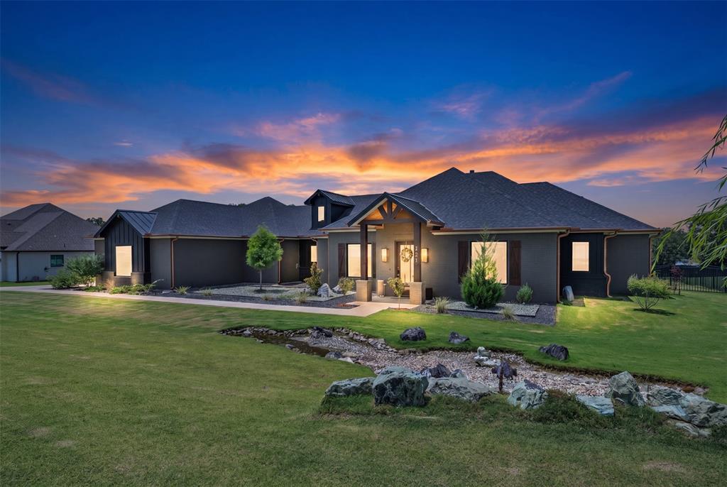 25,000 BUYER INCENTIVE! This exquisite, highly customized 4-bedroom, 2.5-bath home sits on just over an acre in the exclusive gated community of Veridian Point and is located within the highly acclaimed Burleson ISD, zoned for Burleson Centennial High School. Designed with both luxury and functionality in mind, this stunning home showcases a chef's dream kitchen featuring Cambria quartz countertops, premium Café appliances including a beverage refrigerator, a cast iron farmhouse sink, pot filler, and a spacious custom walk-in pantry. The flexible floor plan offers endless possibilities with two front bonus rooms that can serve as dual home offices, a media room, game room, formal living area, or formal dining space to fit your lifestyle. Thoughtful custom details are found throughout, including a built-in microwave that also functions as an air fryer and convection oven, hidden pull-out laundry hampers, a dedicated mudroom entry from the garage, oversized bathrooms with expansive showers and designer tile work, a hidden safe integrated into the custom primary closet system, and walk-in closets in every bedroom. The open-concept living, dining, and kitchen area is perfect for entertaining, highlighted by dual sliding glass doors that seamlessly connect the indoor living space to the large covered back patio. Outside, you'll enjoy mature trees, an outdoor shower, and a spacious backyard with plenty of room to build your dream pool, workshop, or both. Additional highlights include spray foam insulation for energy efficiency, a freshly painted exterior, designer lighting and fixtures throughout, and countless custom upgrades that set this home apart. This one truly has it all—don't miss your opportunity to make it yours!