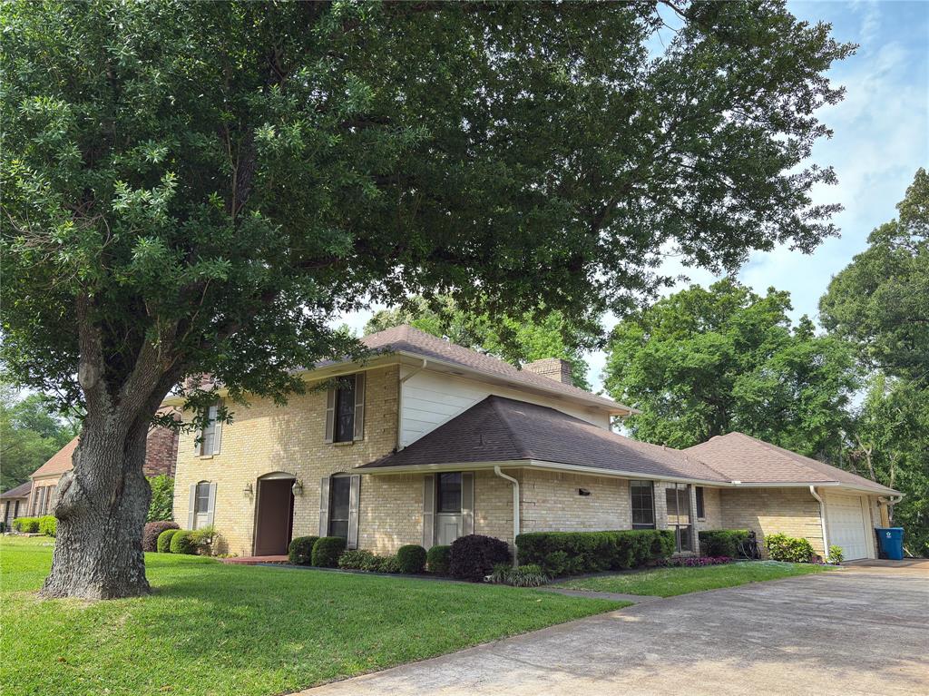 PRICE CUT!! !Walk into this stately 4-2-1 -5-2 Garage Brick home with rich wood overtones located at the edge of town on a cul de sac. This 1-1-2story home with a large room living room with tall ceilings and a WBFP. It opens onto the enlarged open deck. The living room flows into the breakfast area with a bay window plus multiple built ins that included a hutch and desk. The large   features many cabinets and counterspace. The formal dining room could be converted into a game or office area. The roomy downstair primary bedroom with a large walk in closet. The primary bath is a woman's dream with a sunken tub. Walk in closet large separate vanities, many cabinets and drawers plus a walk in closet. The upstair bedrooms features a full bath, one of the bedrooms has a built in gun cabinet. Laundry room and half bath conveniently located off the garage entrance from the wood deck. Enjoy your family gatherings with an enclosed private fence on the deck. Bonus is a storage area with the deck. Great location near town, retail and schools.