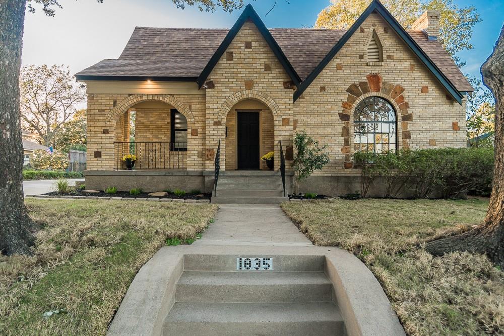 ABSOLUTELY STUNNING MODERN TUDOR FULLY PROFESSIONALLY RENOVATED CLOSE TO THE CEDAR CREST GOLF COURSE AND DOWNTOWN DALLAS!! THIS ELEGANT TUDOR SITS ON A LARGE LOT 0.26 WITH BEAUTIFUL MATURE TREES AND BREATHTAKING VIEWS OF THE PROPERTY AND PERIOD ERA STAINGLASS LARGE FRONT WINDOW!! THIS JEWEL BOASTS 2BEDROOOM,2BATH,2CAR OVERSIZED DETACHED GARAGE AND 1519 SQFT., LARGE INVITING FRONT PORCH, EXCEPTIONAL DRIVE-UP, LARGE FRONT DRIVEWAY AND PRIVATE IRON GATE. HOME HAS AN OPEN FLOORPLAN, LARGE LIVING AREA,PERIOD DECORATIVE FIREPLACE,EXQUISITE FEATURES INCLUDE; ROOF 2024,NEW CUSTOM DOUBLEPANE WINDOWS 2025,GORGEOUS HARDWOOD FLOORS REFINISHED 2025,PERIOD ARCHES AND NICHES,LOTS OF NATURAL LIGHTING,MODERN LED AND RECESS LIGHTS THROUGHOUT 2025,ELECTRICAL UPGRADED 2025,PLUMBING UPGRADED INCLUDING SEWER LINE 2025,TANKLESS GAS WATER HEATER 2025,UPDATED ATTIC INSULATION 2025,CEILING FANS 2025,INTERIOR MODERN PAINTING THROUGHOUT INCLUDING ALL WOOD TRIM AND DOORS 2025,EXTERIOR RENOVATED TO INCLUDE CUSTOM EXTERIOR PAINTING AND CUSTOM ACCENT EXTERIOR LIGHTING 2025. GORGEOUS MODERN BATHROOMS WITH QUARTZ COUNTERS,CUSTOM MODERN CABINETS WITH SOFT CLOSE FEATURE,MODERN HARDWARE AND FIXTURES THROUGHOUT.GORGEOUS MASTER BATHROOM WITH LARGE SHOWER STALL AND FRAMELESS SHOWER GLASS DOOR. INVITING MODERN OPEN KITCHEN WITH LARGE QUARTZ ISLAND WITH SITTING AREA, PANTRY, QUARTZ COUNTERS, CUSTOM CABINETS WITH SOFT CLOSE FEATURE, STAINLESS APPLIANCES INCLUDING REFRIGERATOR,PANTRY,CEDAR CLOSET, SEPARATE FULL SIZE UTILITY CLOSET. LARGE BACKYARD, AND A CONCRETE UNCOVERED EXTERIOR PATIO GREAT FOR ENTERTAINING, LARGE DRIVEWAY, SOD GRASS INSTALLED TO FRONT YARD 2025, OVERSIZED DETACHED 2 CAR GARAGE. DO NOT MISS THE OPPORTUNITY TO OWN THIS STUNNING EXCEPTIONAL ERA VINTAGE TUDOR JEWEL IN THE PICTURESQUE AREA OAK CLIFF!! LOCATED CLOSE TO DOWNTOWN DALLAS, WALKING DISTANCE TO CEDAR CREST GOLF COURSE, CLOSE TO BISHOP ARTS,MAJOR FREEWAYS AND CLOSE TO THE COMING SOON HALPERIN PARK - MOVE-IN-READY - A MUST SEE!