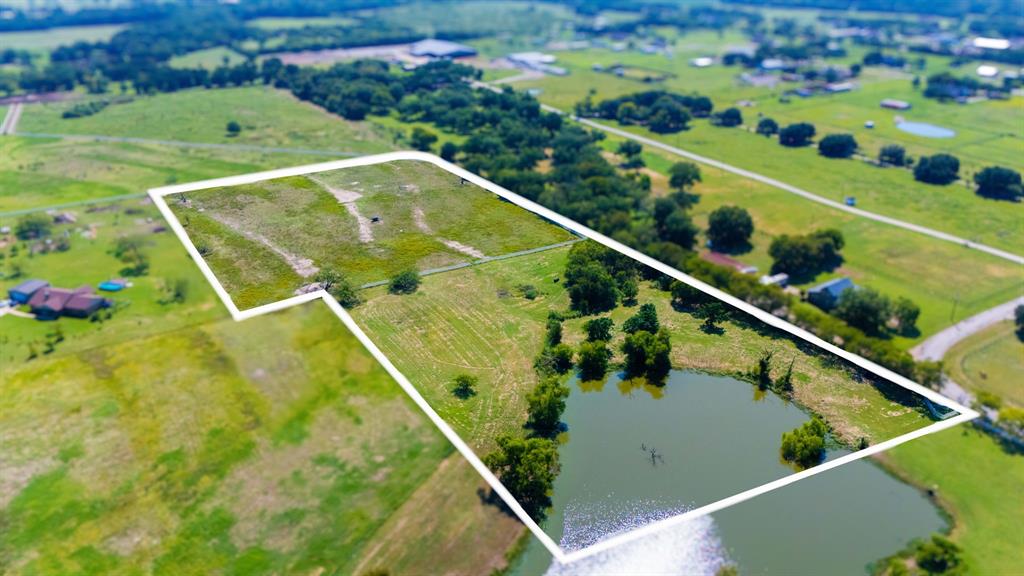 Rare 11.7-acre ( 8 acres buildable) Rural Residential tract in Denton County with City of Denton pre-application feedback already completed for a proposed single-family residence and barn. Property offers open land, pond views, country privacy, and future homesite potential. Buyer to verify all development requirements, floodplain, utilities, permitting, and intended use with City of Denton.
 A picturesque ±third of an acre pond sets the scene for sunsets and easy living, while clusters of gorgeous, mature trees add shade and privacy. You’ll love the setting:  (buyer to verify restrictions), on an asphalt road for smooth access, and in the sought-after Denton ISD. Friendly, well-kept neighboring properties surround you without crowding your space. Bring your builder—or your barndominium and barn plans—and create the homestead, mini-ranch, or weekend escape you’ve been dreaming about. Room for horses, gardens, a shop, and starry skies. This is land that invites you to breathe, plant roots, and live the Texas life with heart and hustle.  AG Exempt