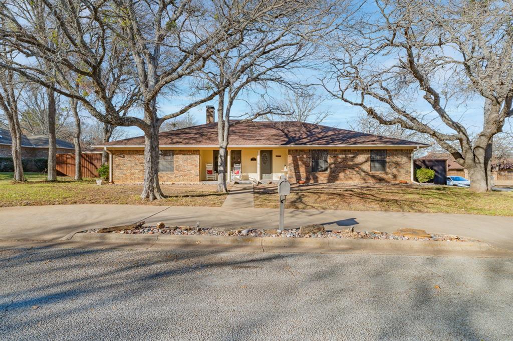 Beautifully maintained home in a highly desirable neighborhood on a spacious corner lot. Features vinyl plank flooring, crown molding throughout, and a split-bedroom floor plan. Large living area with wood-burning fireplace, separate formal dining with detailed dental molding, plus breakfast area. Updated kitchen offers granite countertops, new cabinet fronts, center island with 4-burner flat-surface cooktop, Bosch dishwasher, built-in wall oven and microwave; refrigerator conveys.
Enjoy outdoor living under a large covered patio with hot tub that stays, plus a convenient half bath in the adjacent storage room. Privacy wood fence with concrete curb footing, front and back sprinkler system, rain gutters, and heavy-duty composition roof. Alley access provides abundant off-street parking for approximately eight vehicles.
Versatile built-in garage serves as a spacious den. Separate workshop-storage building includes electricity, stained concrete floors, window unit, built-in shelving, and great workspace. Home is well insulated, total electric, wired for a generator, with two HVAC units, two water heaters, and updated electrical panel-approx. 2 years.
Primary suite features step-in shower, mid-century modern double vanity, and linen closet. Three additional bedrooms and full bath on opposite side of home, including one bedroom with large walk-in closet. Office with carpet; rolltop desk conveys. Washer and dryer negotiable. Move-in ready with exceptional amenities—this one has it all.