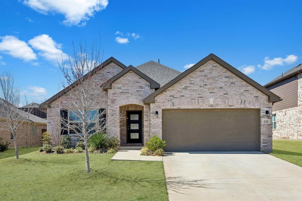 Welcome to your new home in the highly sought-after Sycamore Cove community; ideally positioned on a scenic peninsula near Lake Lewisville. Built by Beazer Homes and offering a transferable builder warranty, this beautifully maintained single-story residence combines modern design, everyday functionality, and an unbeatable location.  Step inside to a light-filled, open-concept layout with soaring ceilings, neutral designer finishes, and engineered hardwood flooring throughout the main living areas. The heart of the home is a stunning chef’s kitchen featuring quartz countertops, crisp white cabinetry, stainless steel appliances, a gas cooktop, subway tile backsplash, and an oversized island with seating. The perfect space for entertaining or casual dining.  The spacious living area centers around a sleek, gas fireplace and flows seamlessly into the dining space, creating an inviting atmosphere for gatherings. Large windows provide abundant natural light and views of the private backyard.  Retreat to the generous owner’s suite, thoughtfully designed for comfort and relaxation. The spa-inspired ensuite bath offers dual vanities, a glass-enclosed shower, and a large walk-in closet.  Enjoy outdoor living in the oversized, fully fenced backyard, ideal for pets, play, or future outdoor enhancements.  Located within walking distance to Sycamore Bend Park, neighborhood green space, and lakeside trails, this home offers peaceful surroundings with quick access to major highways, premier shopping centers, and everyday conveniences—offering the perfect blend of elegance, comfort, and effortless accessibility.  This is more than a home, it’s a lifestyle opportunity in one of the most desirable lakeside communities in Denton County.  3D Tour and floorplan available online on other websites. Community also has NO MUD and NO PID!
