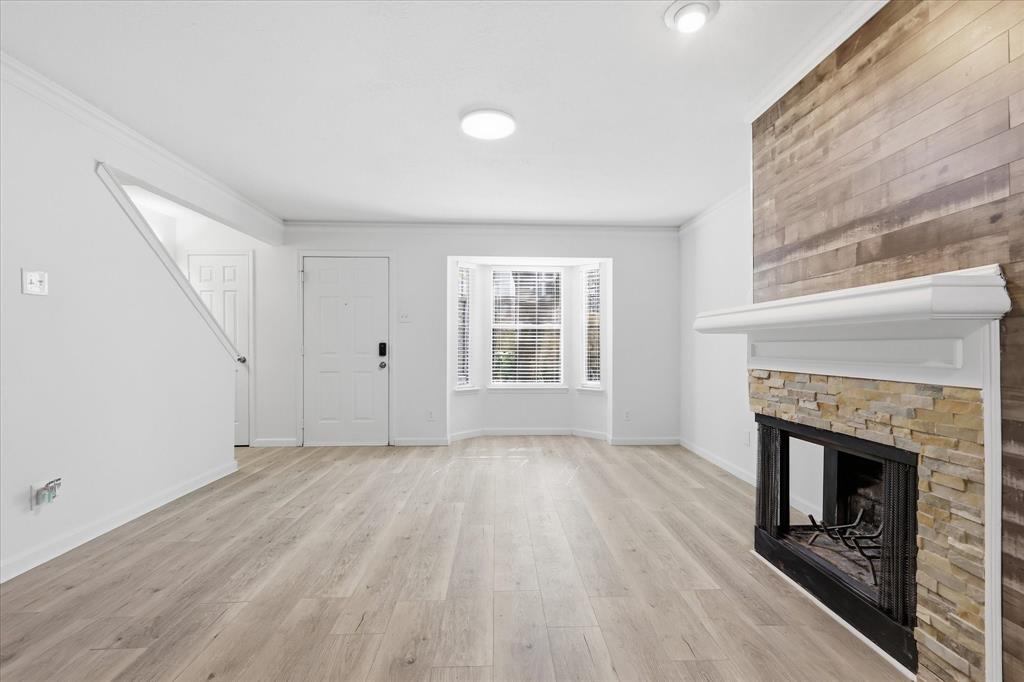 Just steps from your garage door to the Katy Trail and mere minutes to some of Dallas' most popular shopping, dining, and entertainment destinations, this updated condo offers the best on the inside and out. Vaulted ceilings and abundant natural light create an airy feel, while fresh paint and new flooring throughout provide a clean, cohesive look. 

The main living area downstairs is filled with character, featuring a bay window, a fireplace, and custom accent walls that add warmth and personality. A flexible layout offers space for both living and dining, complemented by the kitchen, convenient half bath, and direct access to the attached two-car garage.
Upstairs, each bedroom enjoys the privacy of its own en-suite bathroom, making the layout ideal for roommates, guests, or a dedicated home office. One bedroom also features a balcony, while additional closets and a dedicated laundry area provide valuable storage and everyday functionality.

Whether you're hopping on the Katy Trail, spending the afternoon at NorthPark Center, grabbing groceries at Trader Joe's, or meeting friends at Topgolf, everything you need is just minutes away. Residents also enjoy access to the community pool, making it easy to enjoy the Dallas lifestyle both at home and beyond.