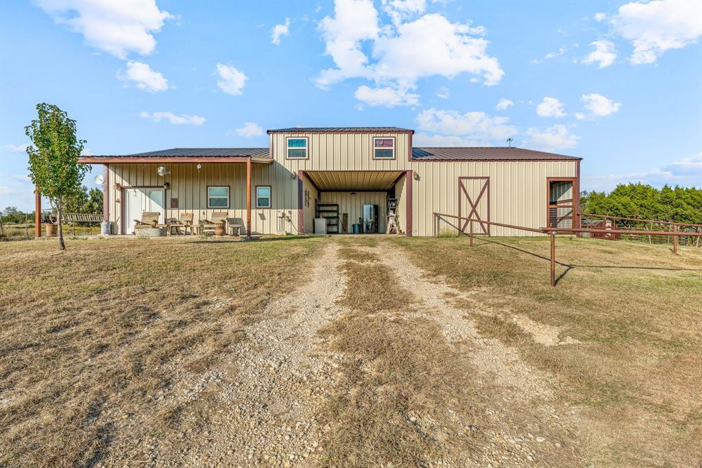 Built in 2016 this amazing 3-2.5 ranch style home sits on 5.051 acres. Located in Horsemans Ranch subdivision allowing access to both an outdoor & covered arena. Home offers 1584 SqFt of living space with concrete flooring on the bottom level & laminate wood on the top. Custom cedar wood detailing throughout giving this home a rustic feel. Kitchen is equipped with electric KitchenAid appliances, dishwasher, vent hood & a double oven. Ready for you & your horses is an attached barn with 2-12x12 stalls, covered shop area or parking & 12x12 area that could double as a feed or tack room. Truly a horse lovers dream!