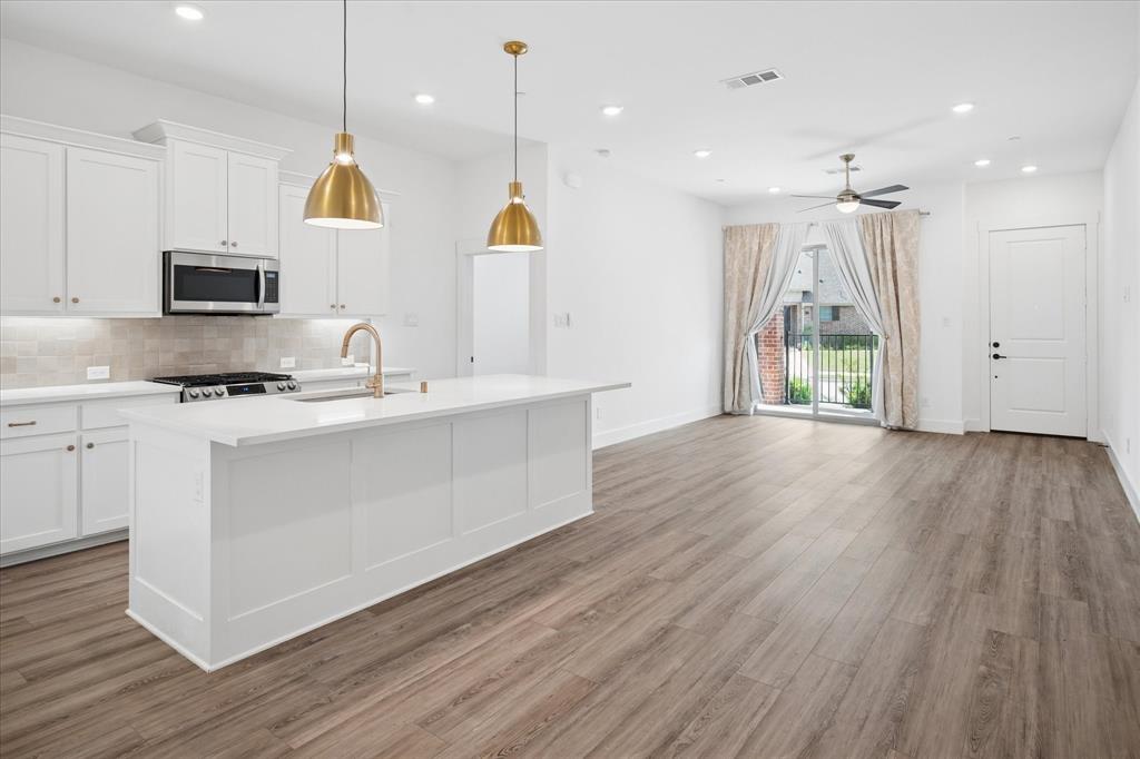 Discover the perfect blend of style and sustainability with this smart-sized, energy-efficient townhome nestled in the heart of Wylie. Featuring 3 thoughtfully designed bedrooms, 2.5 baths, and a spacious 2-car garage, this residence invites sophisticated urban living with a touch of suburban charm. Inside, the home showcases a seamless flow with modern contemporary finishes: an open-concept living area with abundant natural light, beautiful plantation shutters, a sleek kitchen outfitted with stainless steel appliances, and elegant countertops complemented by chic cabinetry. Whether it's hosting dinner parties or enjoying a quiet meal, the kitchen serves as a central hub of the home. The main living space transitions effortlessly into a cozy dining area, perfect for both intimate gatherings and larger celebrations. Downstairs, the primary suite offers a tranquil oasis complete with a well-appointed en-suite bath, featuring dual sinks and a spacious walk-in closet, enhancing both privacy and luxury. The additional two bedrooms upstairs are versatile and can be easily adapted for sleeping, home office, or hobby spaces. Step outside to find a charming patio area, ideal for plants or simply soaking in the warm Texas sun. The low-maintenance yard provides the perfect canvas for gardening enthusiasts or those who appreciate a bit of greenery without the upkeep. Built with energy efficiency in mind, this home is equipped with modern eco-friendly features that reduce utility costs while minimizing their environmental footprint. Its strategic location offers convenient proximity to local shopping, dining, and recreation, making it a desirable address for those seeking comfort and convenience. Experience the best of contemporary living in this impeccable Wylie townhome. With its balance of comfort, efficiency, and modern design, it stands out as a truly exceptional find in today's market. Close proximity to school for easy commute.