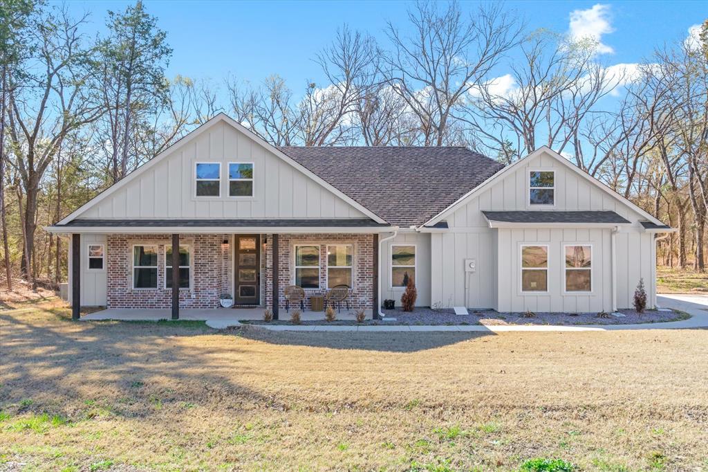 This pristine 2025-built home on 1.32 acres offers a refined blend of modern comfort and practical outdoor space just minutes from downtown Emory. Spanning 1,800 sq. ft., the thoughtfully designed 3-bedroom, 2-bathroom layout features an open-concept living area with durable laminate flooring. The kitchen serves as the heart of the home, equipped with solid surface countertops, a 7’x3’ eat-at island, a classic farmhouse apron sink, and a spacious walk-in pantry. The primary suite provides a private retreat with a large walk-in closet and an ensuite bath featuring dual solid surface vanities, a relaxing garden tub, and a separate glass-enclosed shower.

Superior energy efficiency is a hallmark of this build, which is fully encapsulated with 4” spray foam insulation, including the roofline. The 2-car attached garage features an extended bay designed for a workbench, additional storage, or a freezer. Interior functionality continues in the oversized laundry room, which offers ample room for a dedicated workspace, extra cabinetry, or a second freezer. The outdoor space is highlighted by an 8’ deep covered back porch overlooking a quiet wooded perimeter and a custom stone firepit. For the hobbyist or for extra storage, the property includes a massive 30’x40’ metal workshop with two 10’ roll-up doors. Located only a mile from Hwy 69, this property provides the rare opportunity to own like new construction with a premium shop and the peaceful privacy of a wooded lot.  

Information deemed reliable but not guaranteed. Buyer and buyer's agent to verify all information.
