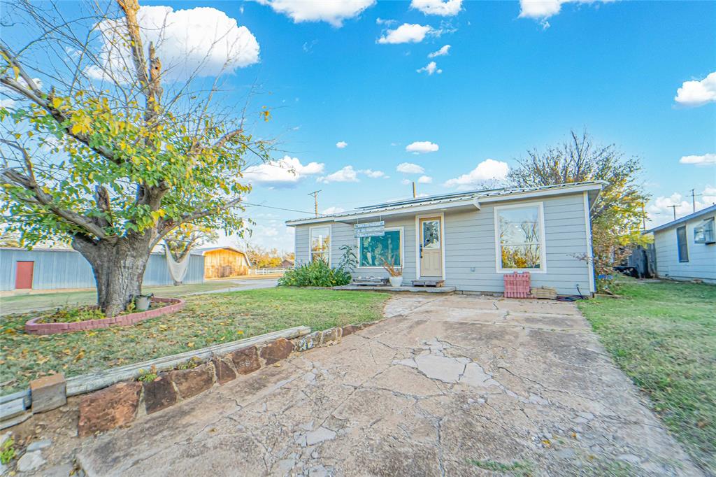 Take a look at this beautiful home on a corner lot! Located just one block from South Elementary, this would make a perfect starter home for a small family or even a rental. Within the last three years this property has been remodeled and meticulously cared for, including a new roof, HVAC system, electrical, plumbing, kitchen, bathroom, flooring, and more. The three-car carport in the back provides plenty of parking along with the driveway around front. The portable shed allows ample storage for all your tools and toys and will convey with the property. The rain water collection totes under the carport provide water for the garden but can be removed at the request of the buyer. Don't miss out on this diamond in the rough and schedule your showing today!

All furniture and appliances are negotiable. 
Additional vacant lot to the South is available for purchase.