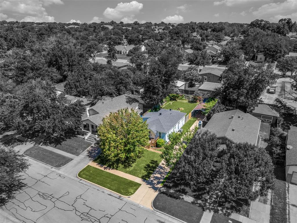 LOCATION CANNOT BE BEAT. Ready to build your dream home or investor looking to have the perfect home or lot for your growing portfolio. PRICED BELOW MARKET. Motivated Sellers! Located in the heart of Arlington Heights, this beautifully landscaped lot offers a rare opportunity in a highly desirable westside neighborhood. Just minutes from Camp Bowie, Central Market, and Fort Worth’s premier museums, the property provides both charm and unbeatable convenience. Zoned B Two-Family, the lot allows for one-family and two-family (attached or detached) dwellings, with a minimum lot size of 5,000 sq. ft. for two attached units on a single lot — offering strong potential for redevelopment or investment. The existing structure is a charming cottage with updated features, including laminate flooring, quartz kitchen counters, a renovated bathroom, and a spacious utility room. A large backyard, wooden deck, mature trees, and a storage shed complete the picture. The second bedroom functions well as a home office. Whether you’re looking to build, invest, or simply secure a prime piece of land in a tree-lined, walkable neighborhood, this property is full of possibilities. Property is zoned for Duplexes so the home could be torn down and a duplex built. Making this property a great investment now and in the future.