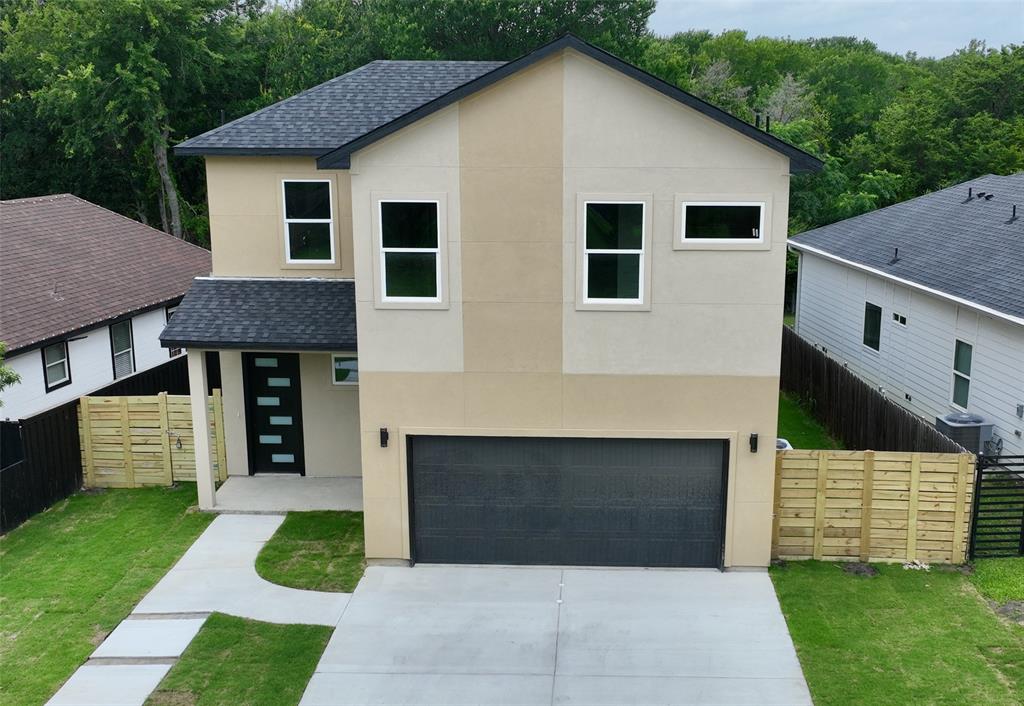 Experience modern living in this stunning new construction home, scheduled for completion this week! Offering 4 bedrooms, 3 full bathrooms, and approximately 2,100 square feet of thoughtfully designed living space, this two-story residence features an open-concept layout with luxury vinyl plank flooring, abundant natural light, and contemporary finishes throughout. The spacious living area is highlighted by a sleek electric fireplace with custom accent paneling that extends to the built-in shelving, complete with integrated LED lighting for a sophisticated designer look. The beautifully appointed kitchen showcases a large island with decorative wood panel detailing, ample prep space, and seamless flow into the dining and living areas, making it ideal for entertaining. Upstairs, the private primary suite offers a spa-inspired retreat with a double vanity, separate shower, and generous walk-in closet. Additional bedrooms provide flexibility for family, guests, or a home office. Outside, enjoy a covered patio overlooking the backyard, perfect for relaxing or hosting gatherings. With striking modern architecture, stylish finishes, and a two-car garage, this move-in-ready home is an exceptional opportunity to own a brand-new property in Dallas. Schedule your showing today!