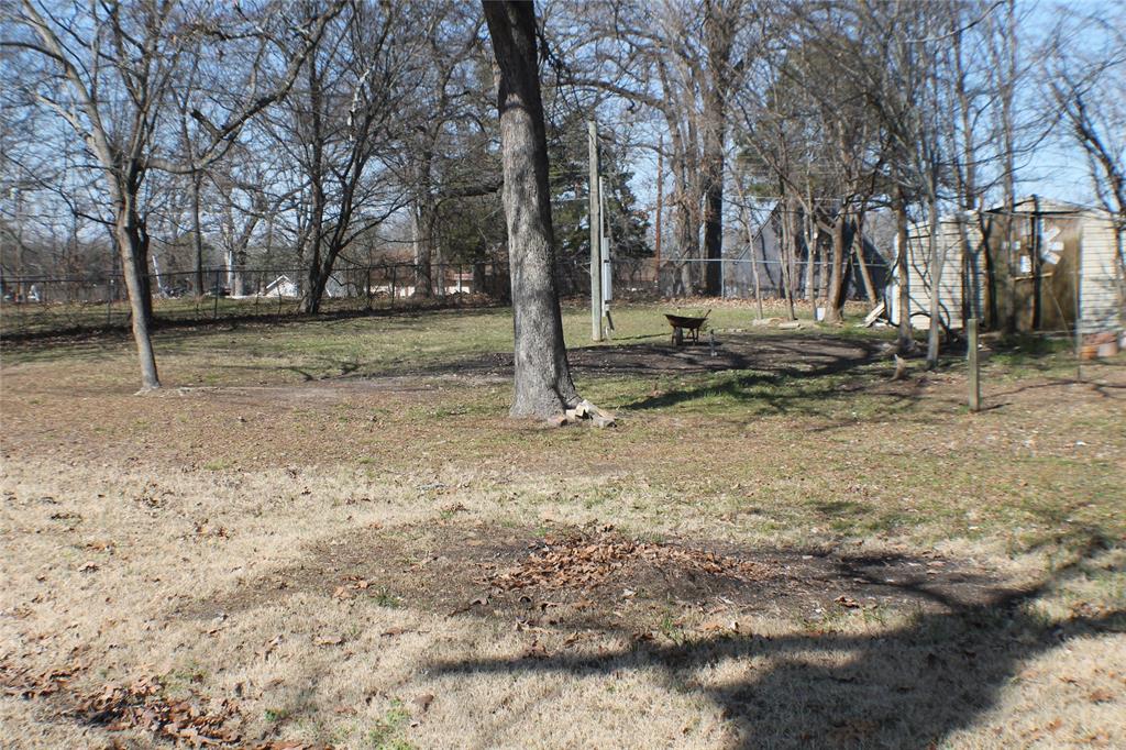 Three adjoining lots totaling approximately half an acre offer a great opportunity for a new build. Property includes an older mobile home that will need to be removed. Several storage sheds are on site and are functional. Existing septic system and water well are in place; buyer to verify condition and usability. Level lot with room to build. Convenient location with easy access to nearby neighborhood boat ramp.  Value is in the land and utilities.