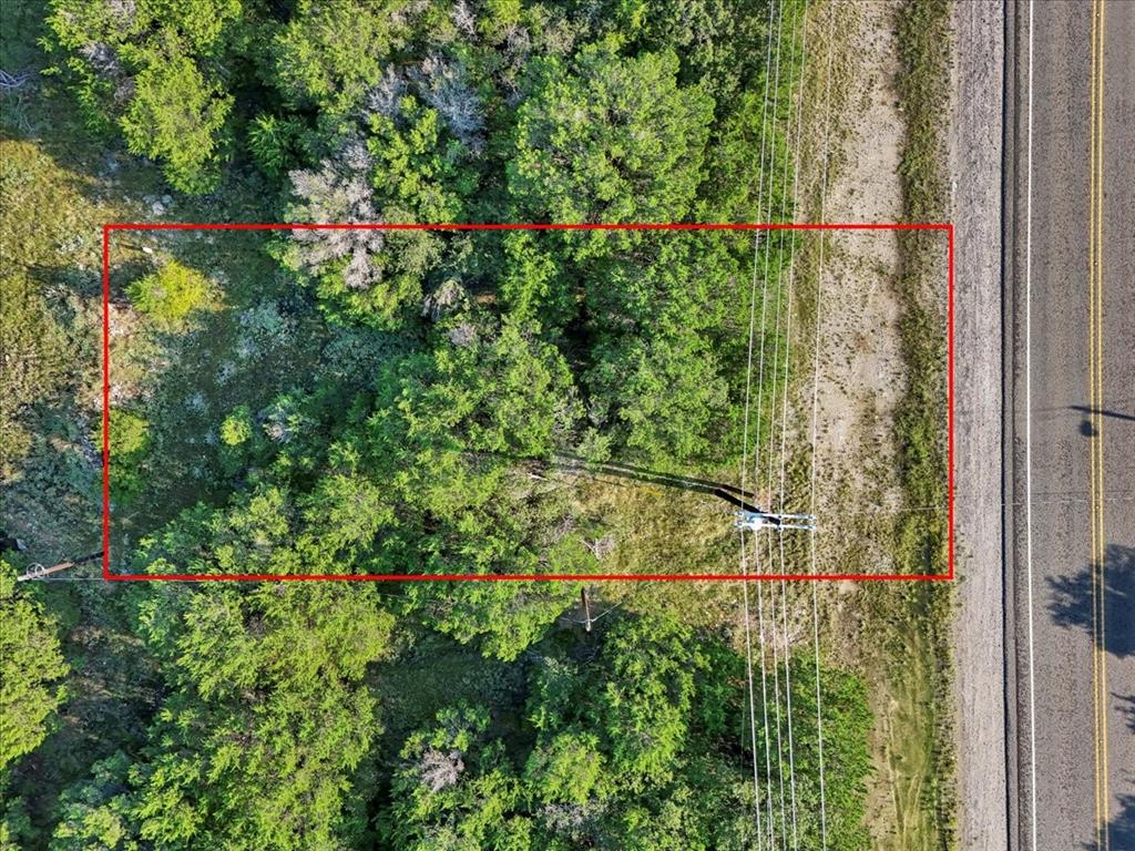 Nestled just off Tin Top Hwy in sought-after Granbury, Texas, this .04-acre unimproved lot offers a rare opportunity to own a small slice of land in a prime location—without the constraints of city limits. Beautifully wooded with many trees, the property provides natural shade, privacy, and a tranquil setting that’s perfect for your future home or getaway. Enjoy the peacefulness of rural living while staying just a short drive from Lake Granbury, where you can boat, fish, or relax by the water. You're also close to shopping, dining, and everyday conveniences, making this a truly ideal location. Whether you're looking to build your dream home, a weekend retreat, or invest in land with big potential, this lot offers the best of both worlds—serenity and convenience. Don't miss out on this unique opportunity!