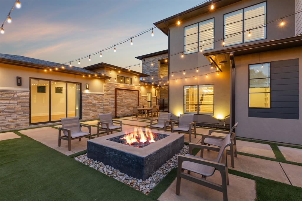 Striking transitional open concept 2 story home is located within the gated community of The Legacy on nearly a half acre! This custom built Maykus home was thoughtfully designed, offers 5 full bedrooms, each with their own En-suite, 2 living areas, a private guest quarters or casita, storm shelter, and extensive outdoor living! This home showcases high quality finishes such as, white oak wood flooring, extensive quartzite throughout, upscale appliances, custom wallpaper, designer lighting, and more! The outdoor living is an entertainer's dream with sport court, extensive landscaping, custom sculptured basalt garden, a private courtyard draped with cafe lights, oversized custom fire pit, outdoor dining, covered patio with gas grill and fireplace, and scenic views of the community pond! NEW ROOF & GUTTERS INSTALLED AUGUST OF 2024!