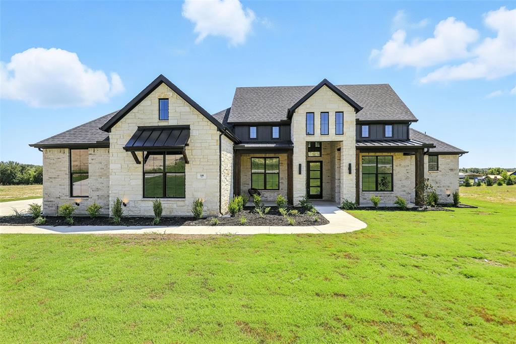 Luxury features at an affordable price in the highly sought-after Santana Ridge—where many homes exceed $1M. This thoughtfully designed floorplan at 108 Gibson Bend showcases exceptional craftsmanship and an impressive list of upgrades throughout.
From the moment you enter, you’ll notice elegant coffered ceilings and custom accent details in the primary suite, game room, living area, and office, creating a refined yet inviting atmosphere. Light-toned flooring, luxury patterned carpet, and a stunning tiled fireplace elevate the main living space, while the beautifully designed kitchen serves as the heart of the home—perfect for entertaining or everyday living.
Built by Silver Leaf Homes, a trusted builder with over 30 years of experience, the quality and attention to detail are evident at every turn. This home is located outside city limits, offering the added benefit of low property taxes (approximately 1.8%)—a rare find in such a desirable community.
If you’re looking for upscale finishes, smart design, and long-term value in Weatherford, this home is truly a must-see. ***$10,000 SELLER CONCESSIONS TOWARDS CLOSING COST OR OFF THE PRICE!!***