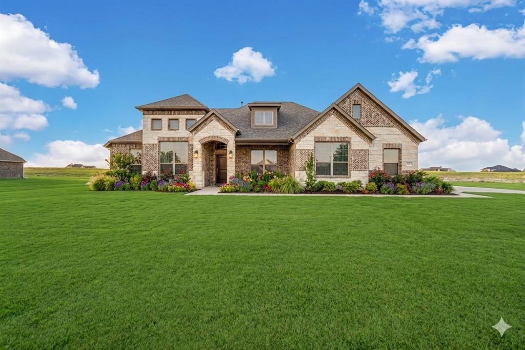 HUGE PRICE IMPROVEMENT + up to $10,000 flex cash!! Welcome to 128 Lila Lake, a beautifully crafted NEW CONSTRUCTION home in a peaceful community just MINUTES FROM LAKE WAXAHACHIE. This popular Glenbrook VI floor plan offers 4 bedrooms, 2 baths, and a private OFFICE, a cross 2,161 sq ft of well-designed living space.
The open-concept layout features HIGH CEILINGS, abundant natural light, and a spacious living area with GAS FIREPLACE. 

The kitchen is designed for both style and function with a large quartz island, stainless appliances, BUILT IN OVEN AND MICROWAVE, and ample CABINETRY all flowing seamlessly into the dining and living areas.

The primary suite includes separate DUAL VANITIES, a soaking tub, separate shower, and oversized walk-in closet WITH BUILT-INS. 

Step outside to the COVERED PATIO and gently sloped backyard - ideal for creating a custom outdoor retreat. The elevation provides a unique opportunity you won't get with a flat lot. Imagine tiered landscaping, an elevated patio fire pit area, or a resort-style pool design - adding both character and long-term value. 

Additional features include a TANKLESS WATER HEATER and 3-CAR GARAGE. Located in Waxahachie ISD, this home offers the perfect blend of space, comfort, and convenience.

Enjoy quiet living with easy access to Lake Waxahachie, parks, shopping, dining, and major commuting routes.

Homes with this combination of space, layout, and acreage, this close to amenities are hard to find at this price. Schedule your showing today!

Virtually staged for potential.