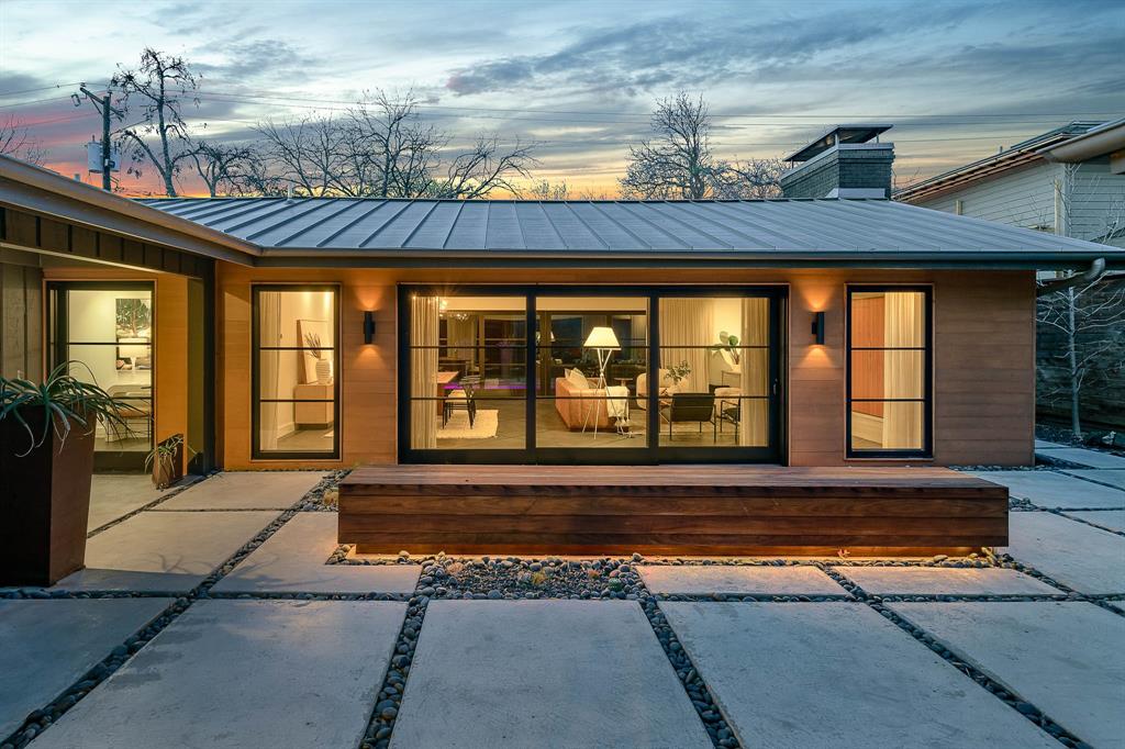 Courtyard Modern: an exquisite mid-century-turned-modern masterpiece nestled in sought-after Mockingbird Park. Architect Jamie Olsen Ali of Demesne incorporated thoughtful and intentional designs for an extensive 2015 renovation. The sleek exterior blends with its surrounding, but prepare to be impressed as you step inside to a meticulously refined interior! Large windows and sliding doors allow for natural light to highlight the open living and dining areas. The kitchen boasts Thermador appliances, custom walnut cabinetry, and finishes that are sure to satisfy the most discerning tastes. Step outside to a lux pool and an impressive outdoor living area under a cantilevered canopy. Attention to detail is apparent in every room - from designer finishes and fixtures to imported flooring and custom millwork, this home is a showcase of contemporary sophistication. Easy access to fine dining, shopping, and entertainment. Don't miss the opportunity to own this remarkable modern sanctuary!